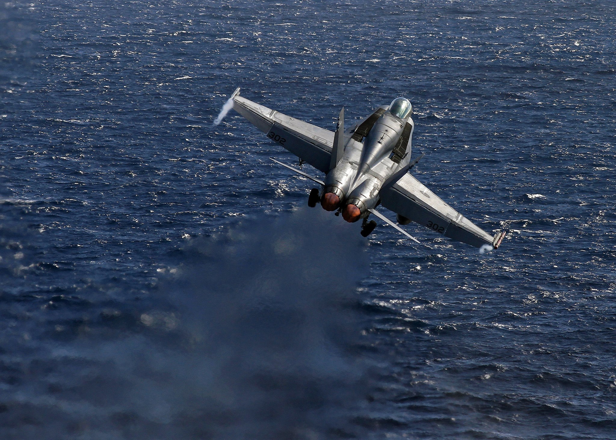 F-18 Super Hornet flying over the ocean HD Wallpaper