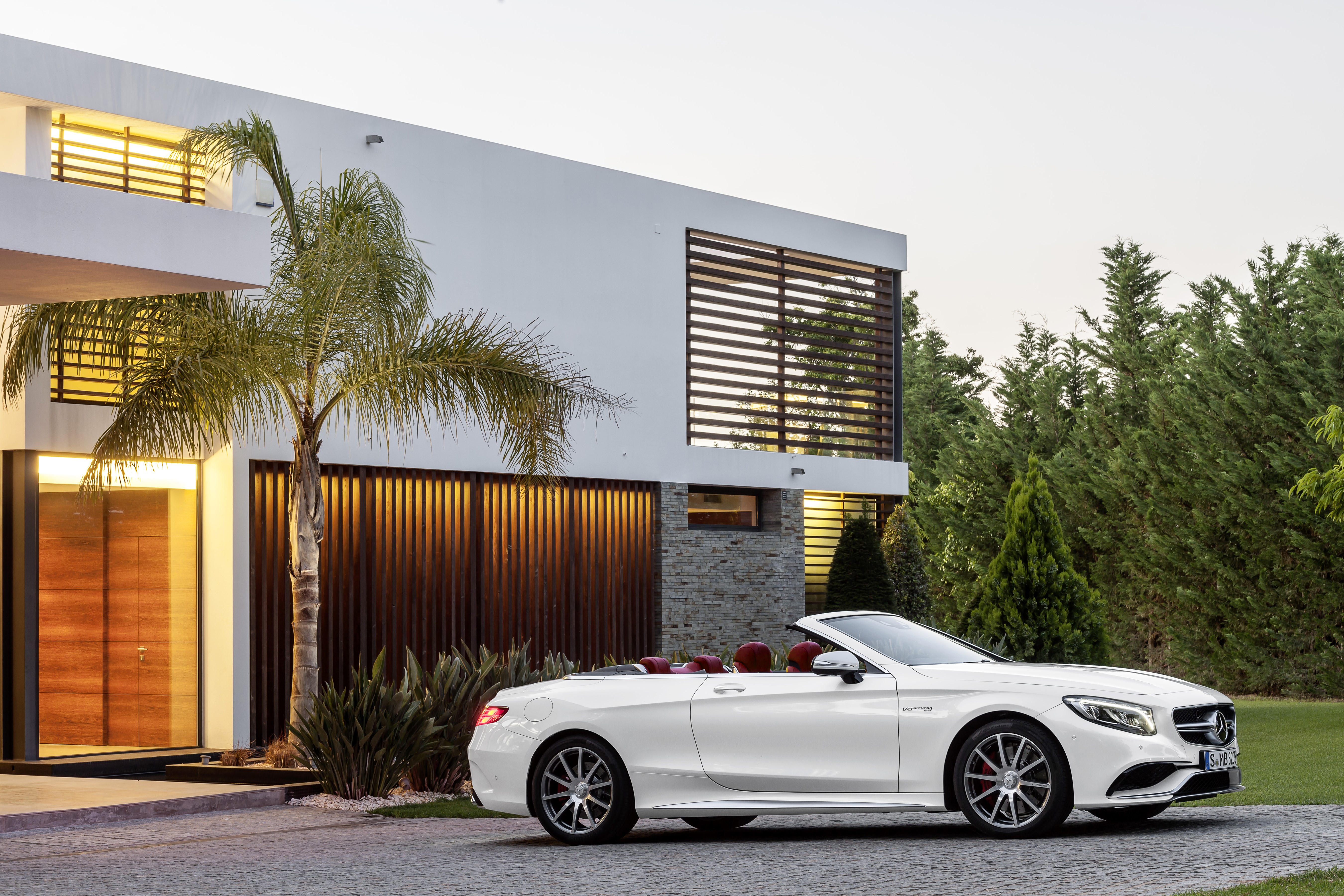 White Mercedes-Benz S-Class Cabriolet parked by a modern house HD Wallpaper