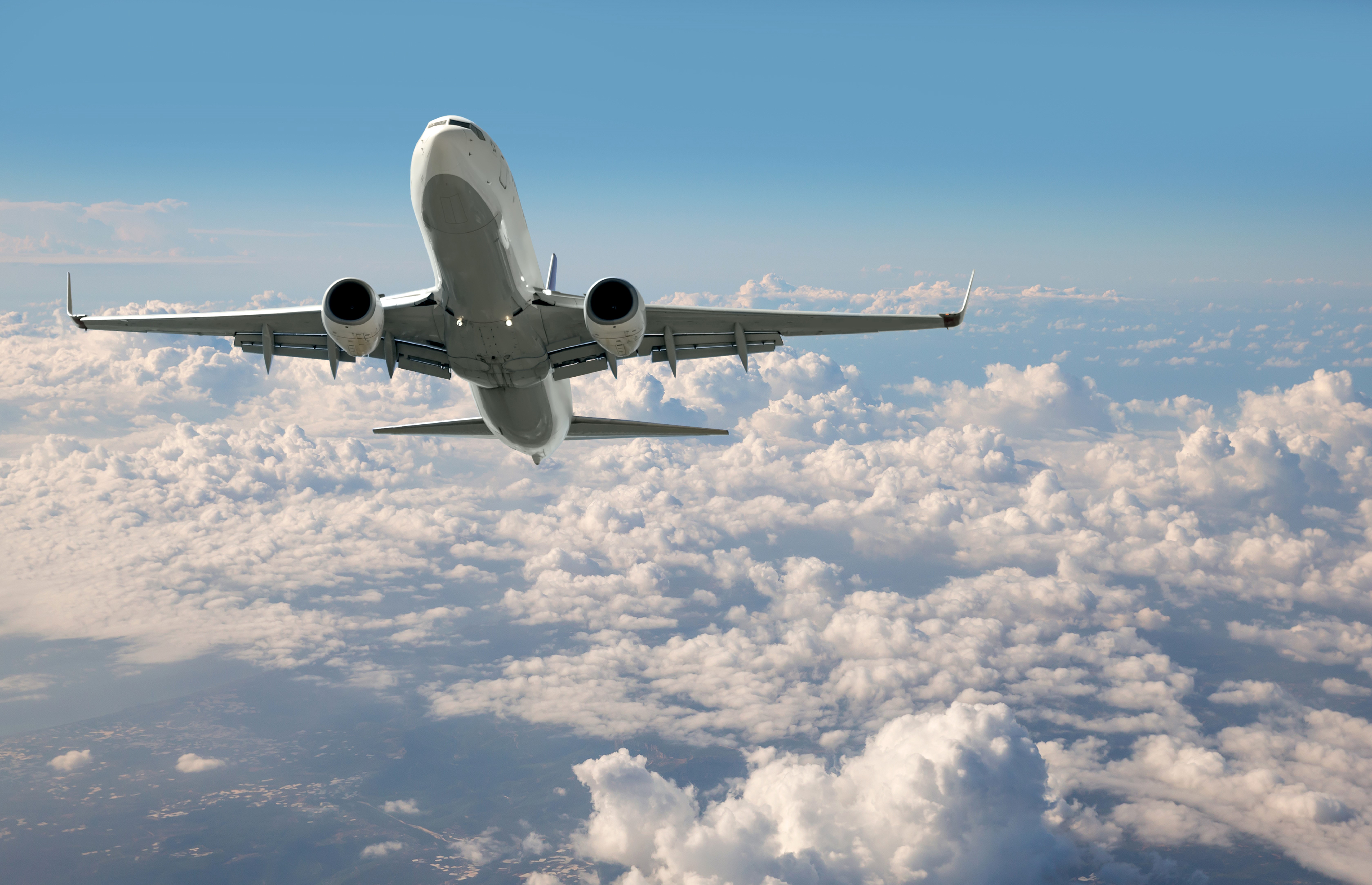 Airplane flying above clouds HD Wallpaper