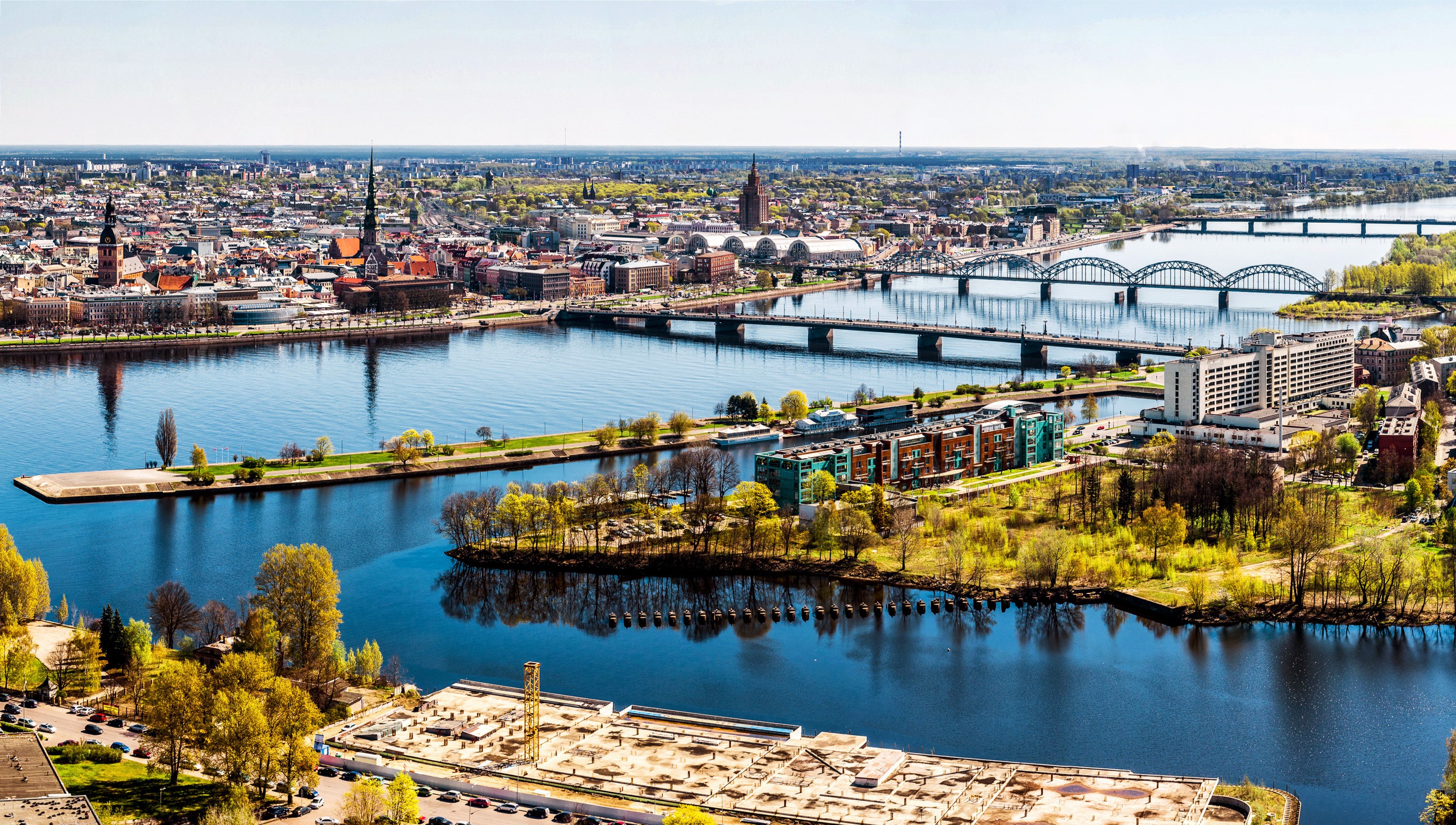 Riga, Latvia cityscape with river and bridges HD Wallpaper