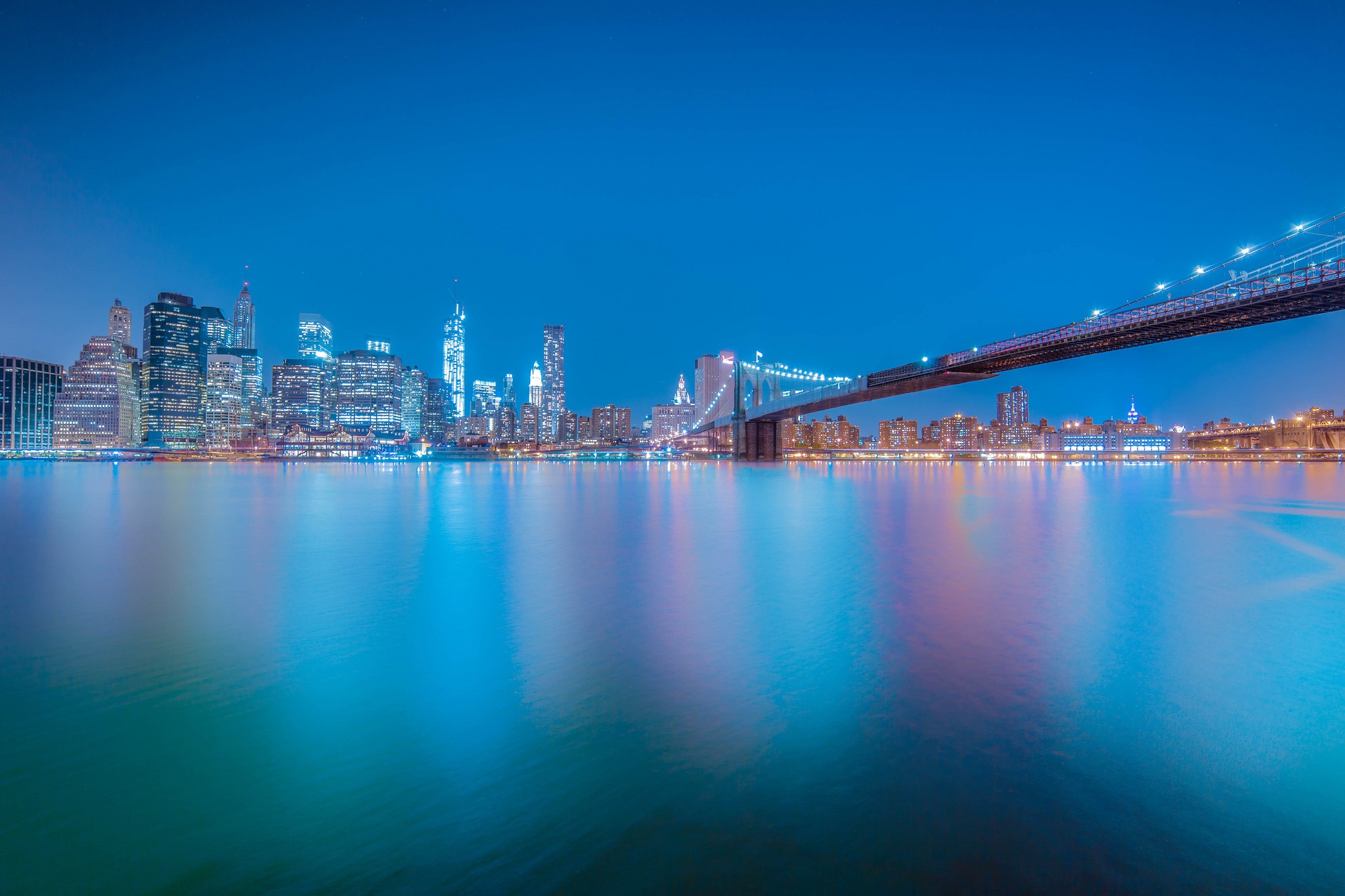 New York City skyline and Brooklyn Bridge at night HD Wallpaper