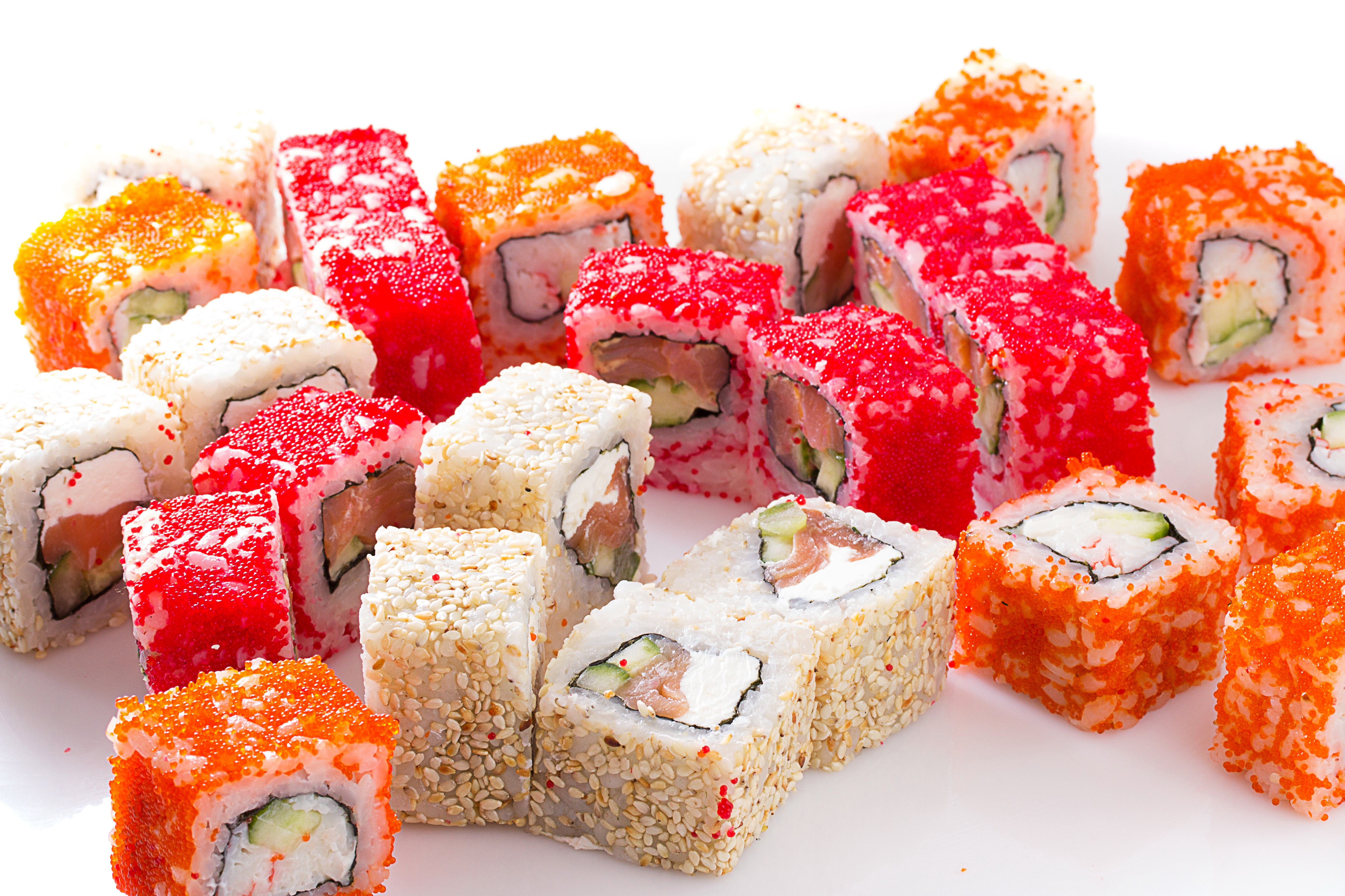 Assortment of Sushi Rolls with Caviar and Sesame Seeds HD Wallpaper