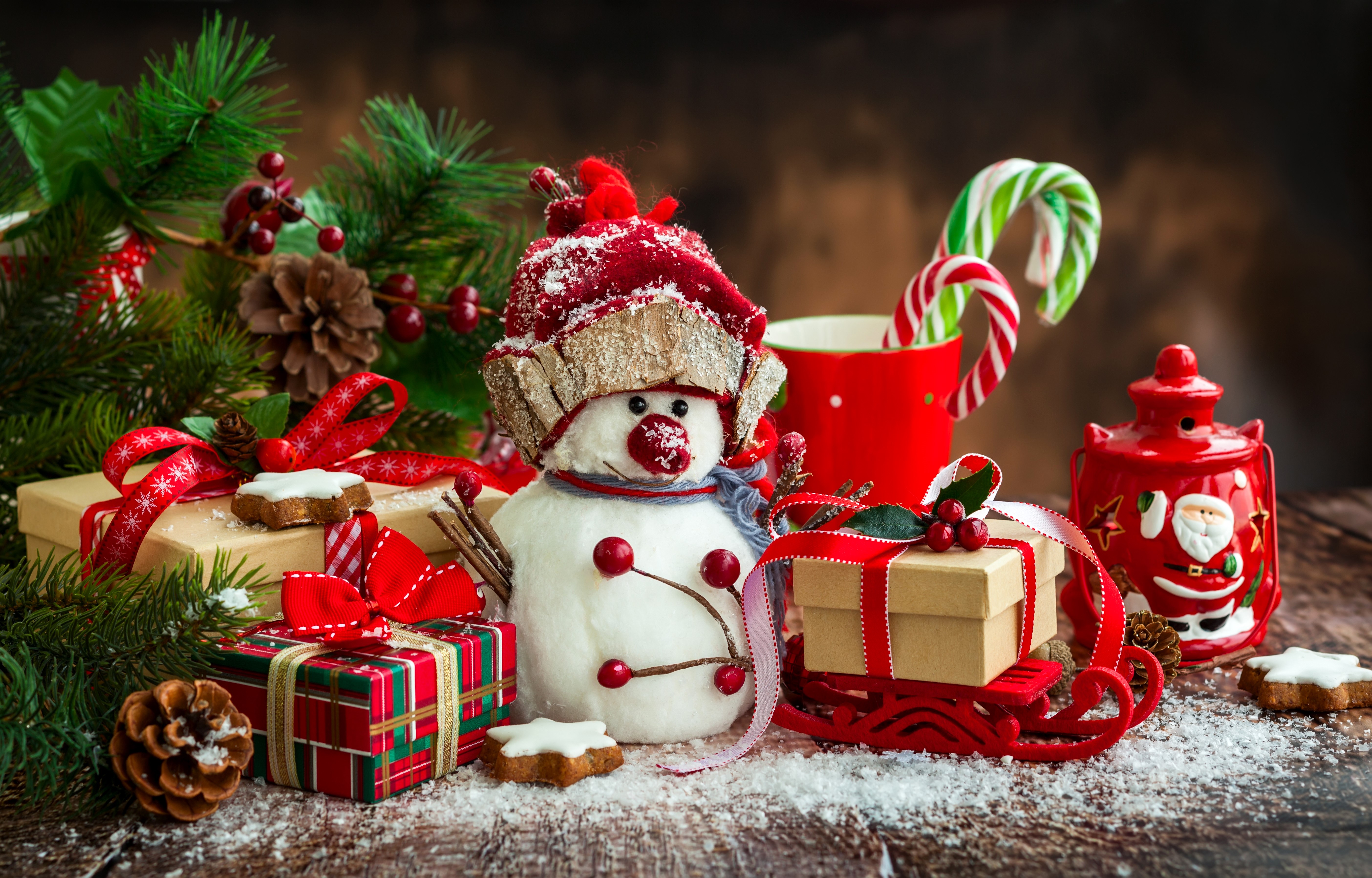 Christmas scene with snowman, gifts, and candy canes HD Wallpaper