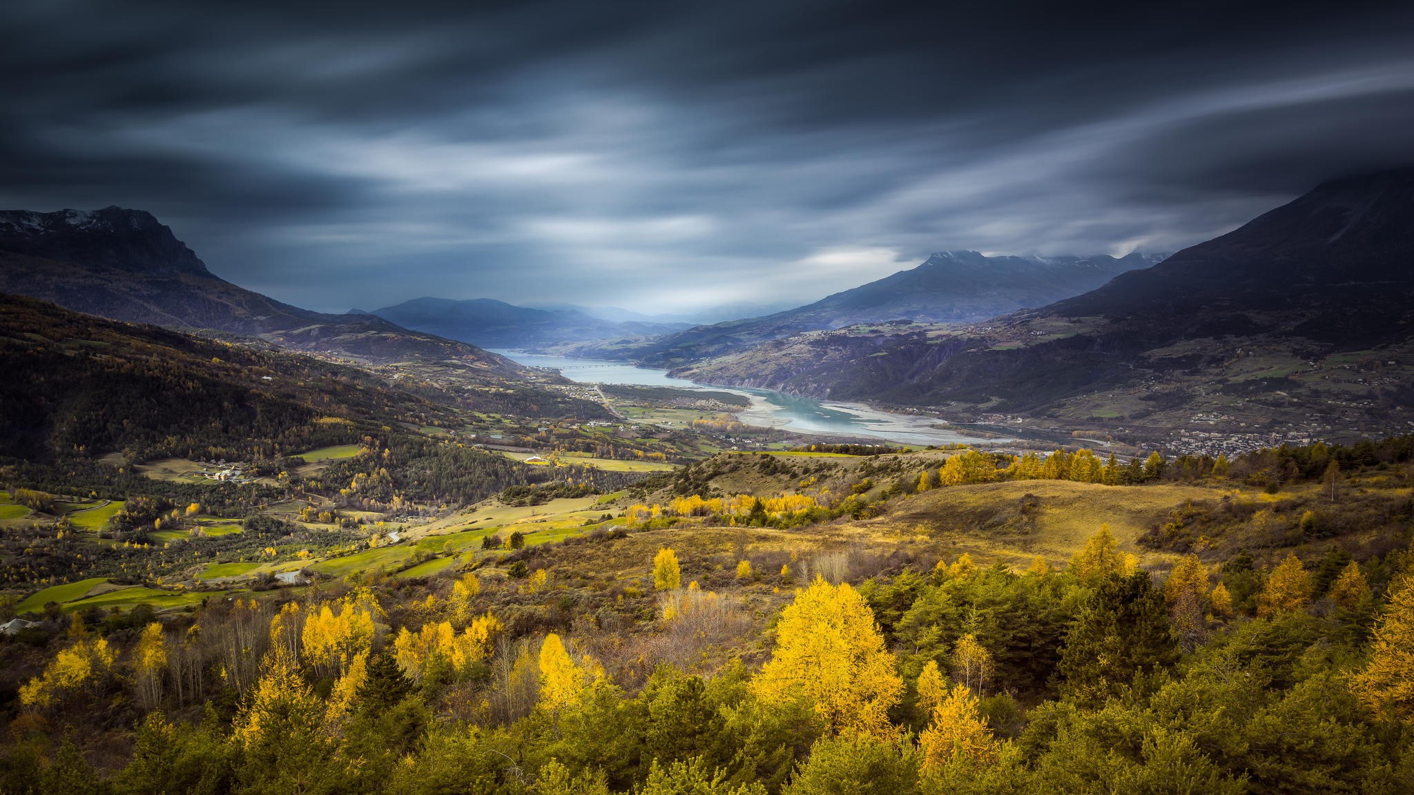 Autumn valley with a river and mountains under stormy sky HD Wallpaper