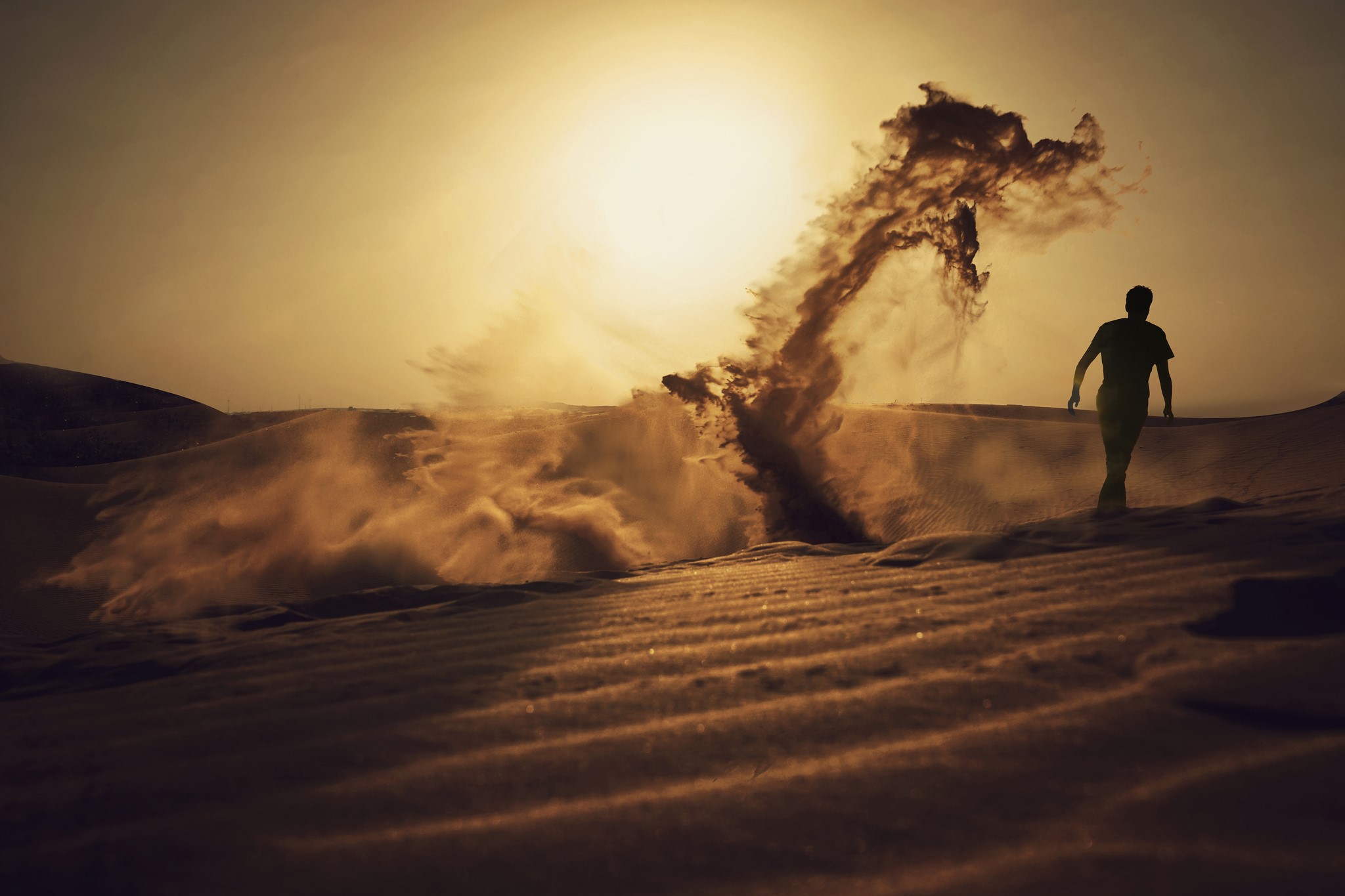 Man walking in a desert with a sandstorm HD Wallpaper