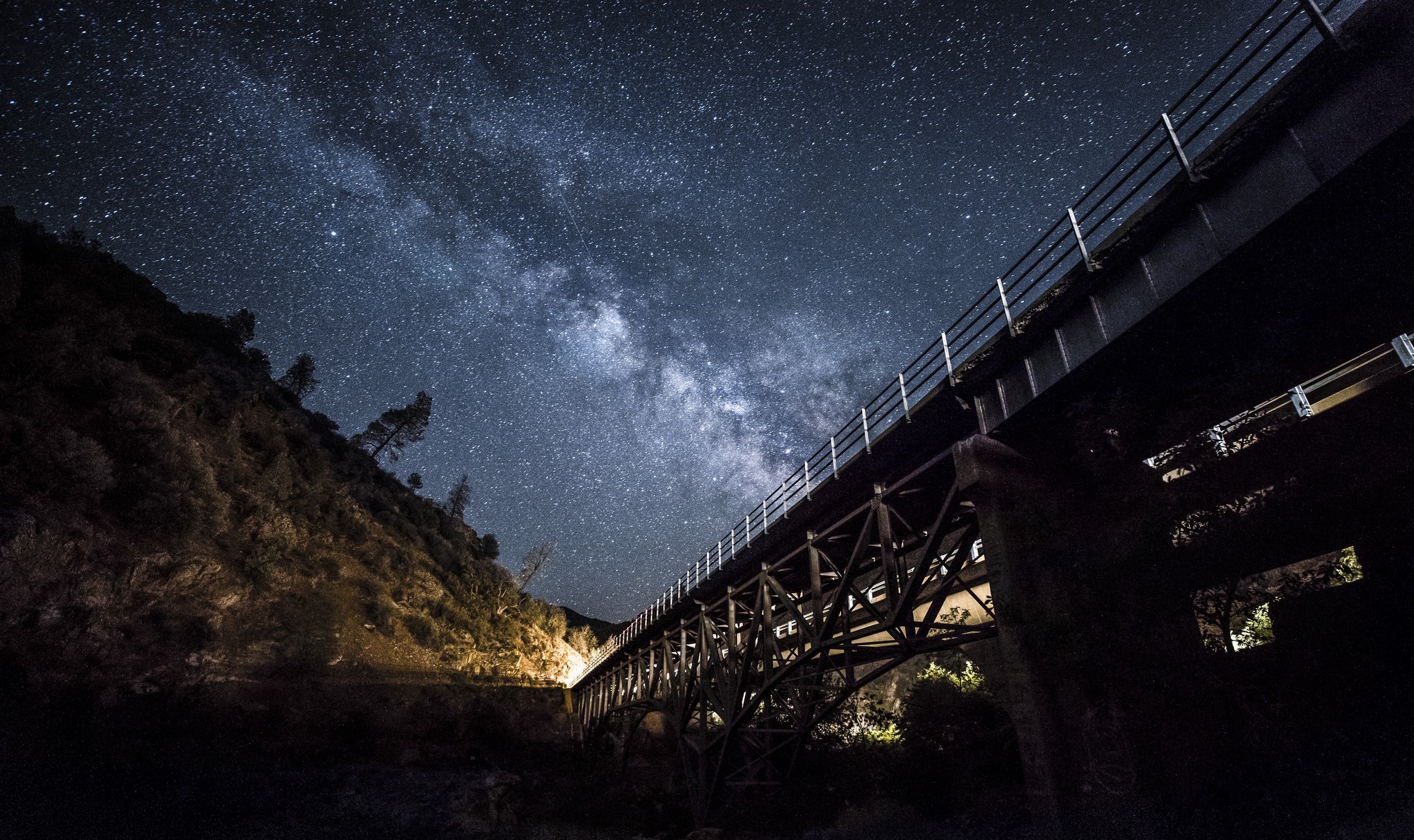 Milky Way over a bridge at night HD Wallpaper