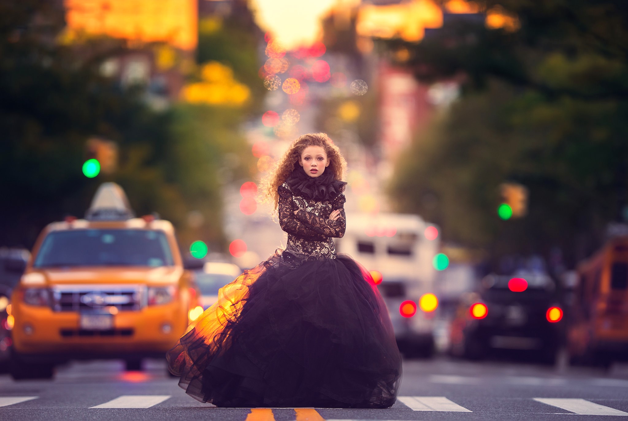 Woman in a black dress on a city street HD Wallpaper