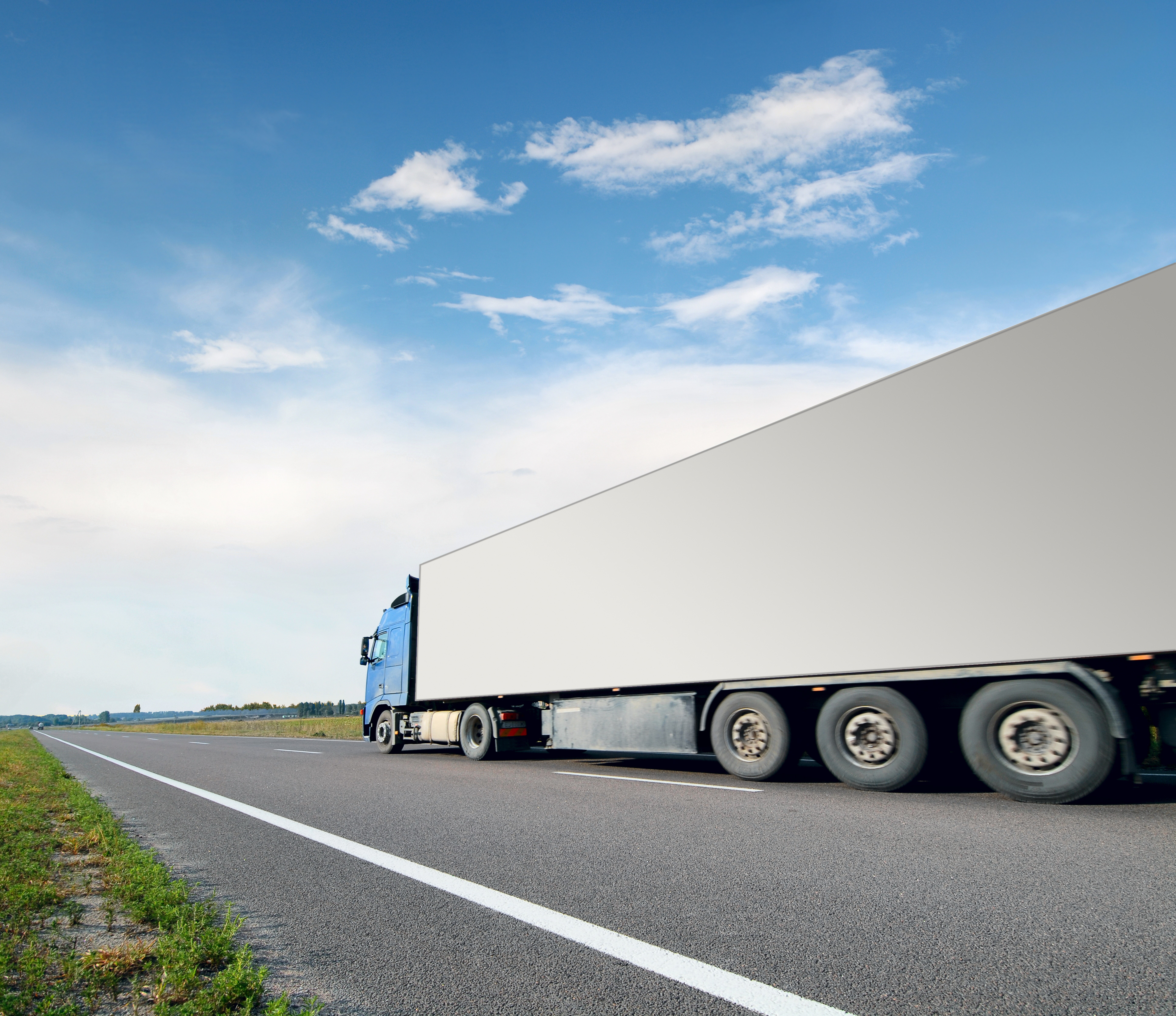 Blue truck with white trailer on a road HD Wallpaper
