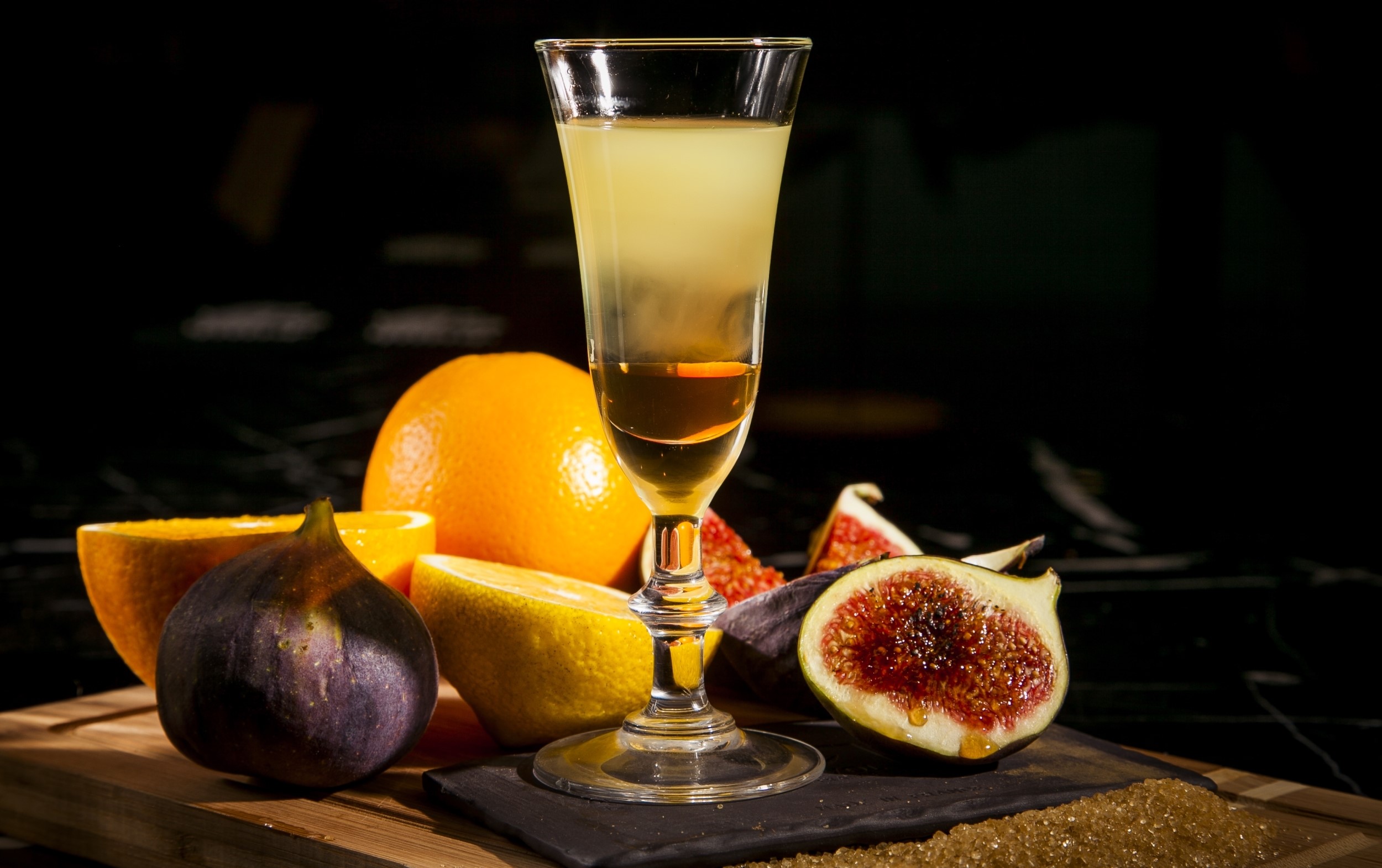Cocktail with orange, lemon, and figs HD Wallpaper