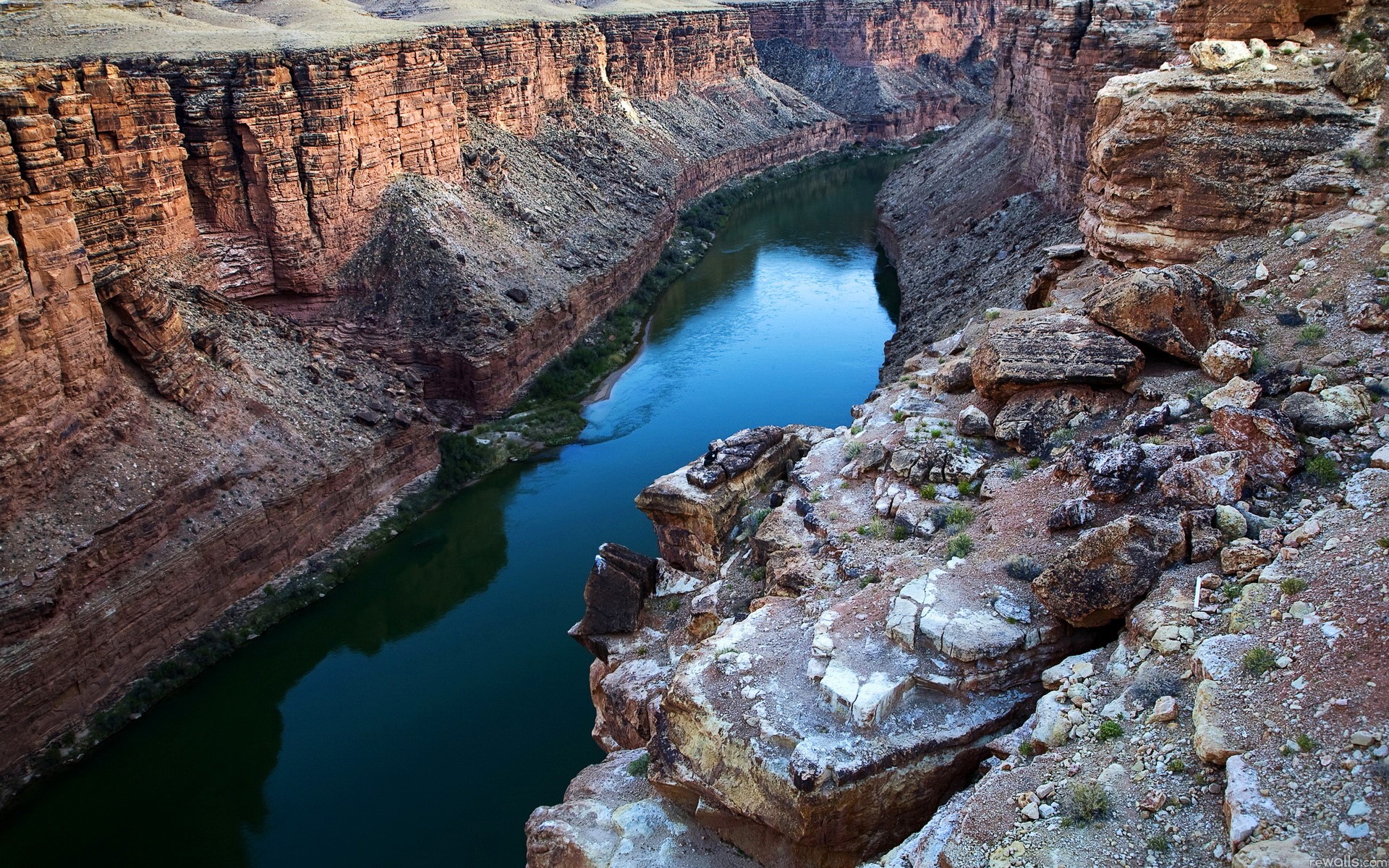 River flowing through a deep canyon with rocky cliffs HD Wallpaper