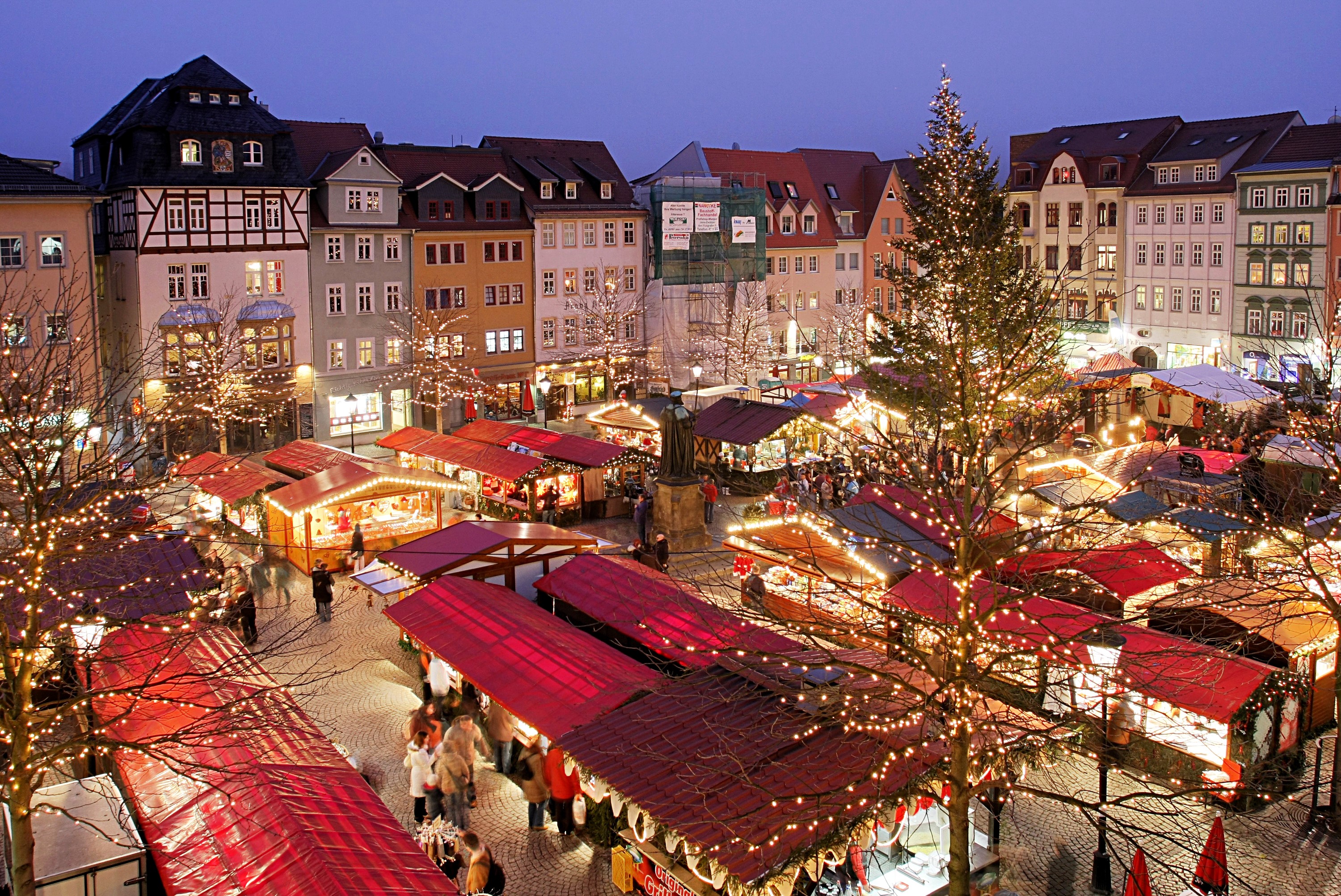 Christmas Market in a European Town Square at Night HD Wallpaper