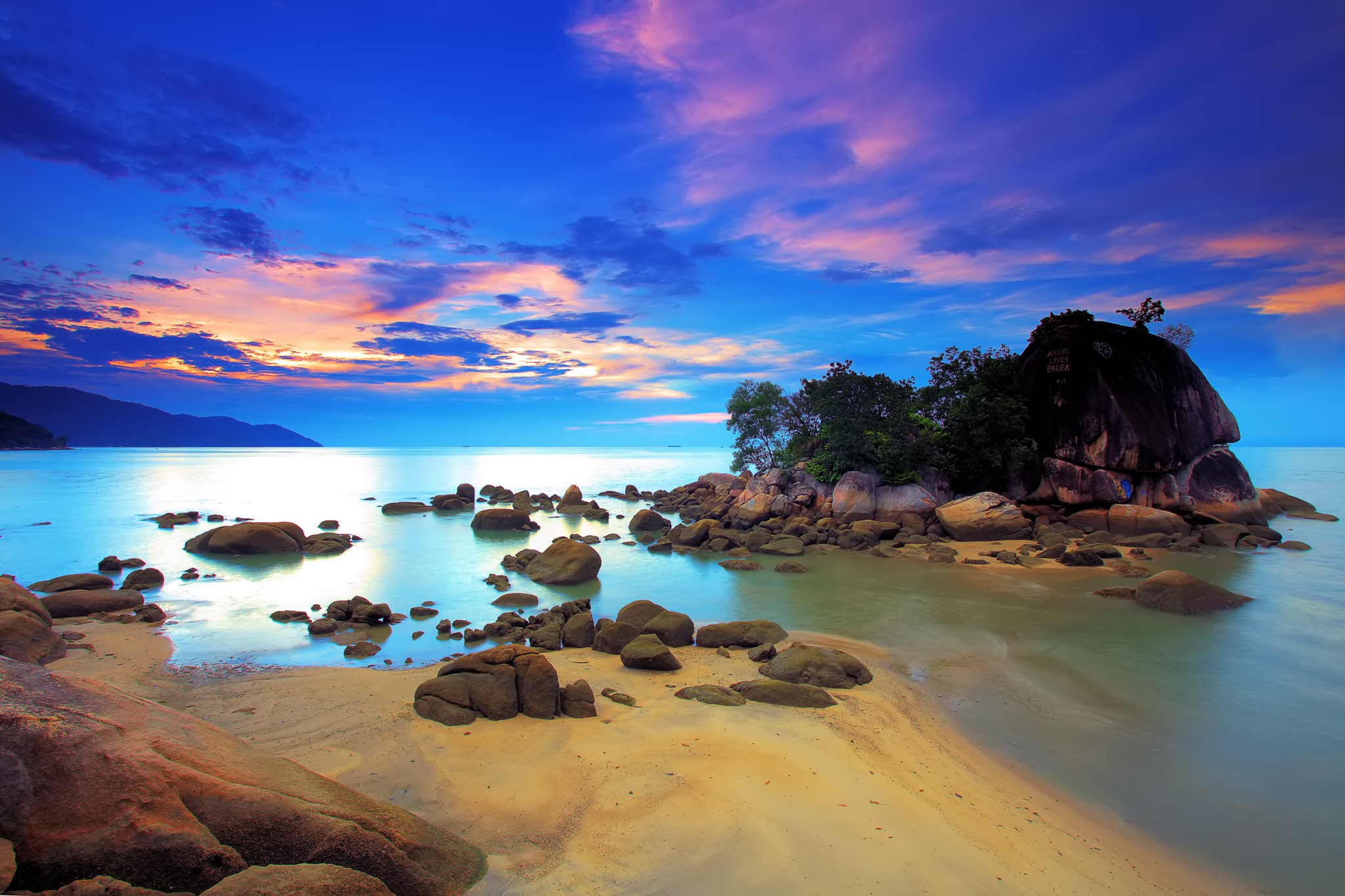 Rocky beach at sunset with colorful sky HD Wallpaper