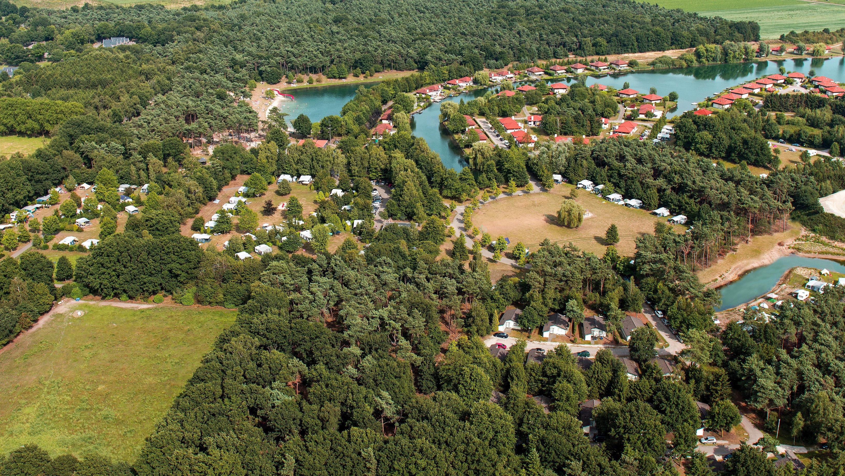 Aerial view of a resort with lakes and trees in Limburg, Netherlands HD Wallpaper