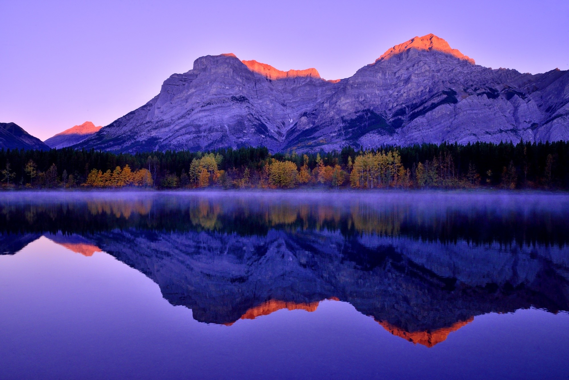 Mountains reflected in a lake at sunrise, Kananaskis, Canada HD Wallpaper