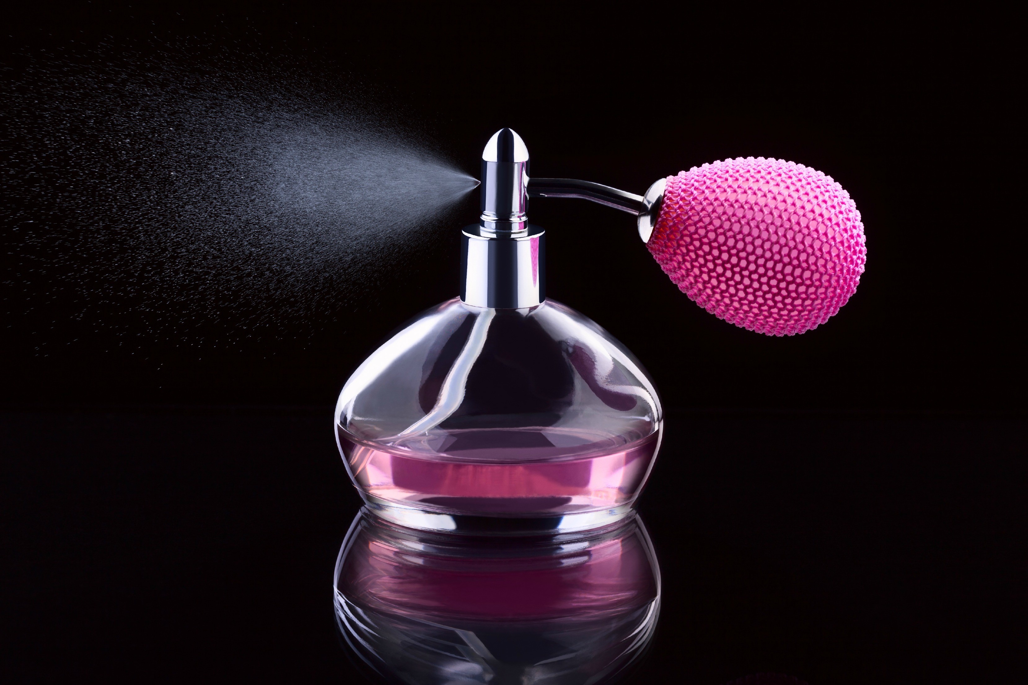 Perfume bottle with pink bulb sprayer HD Wallpaper