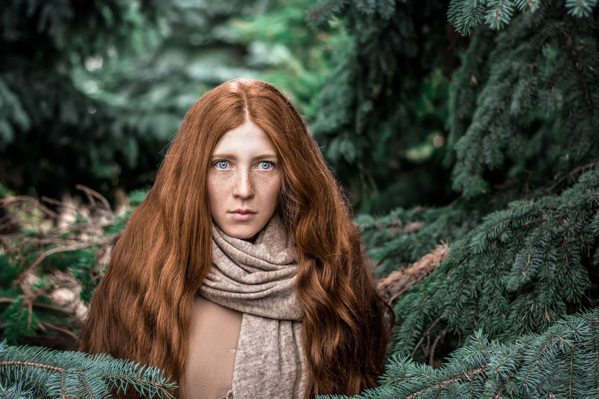Woman with long red hair and blue eyes in a forest HD Wallpaper