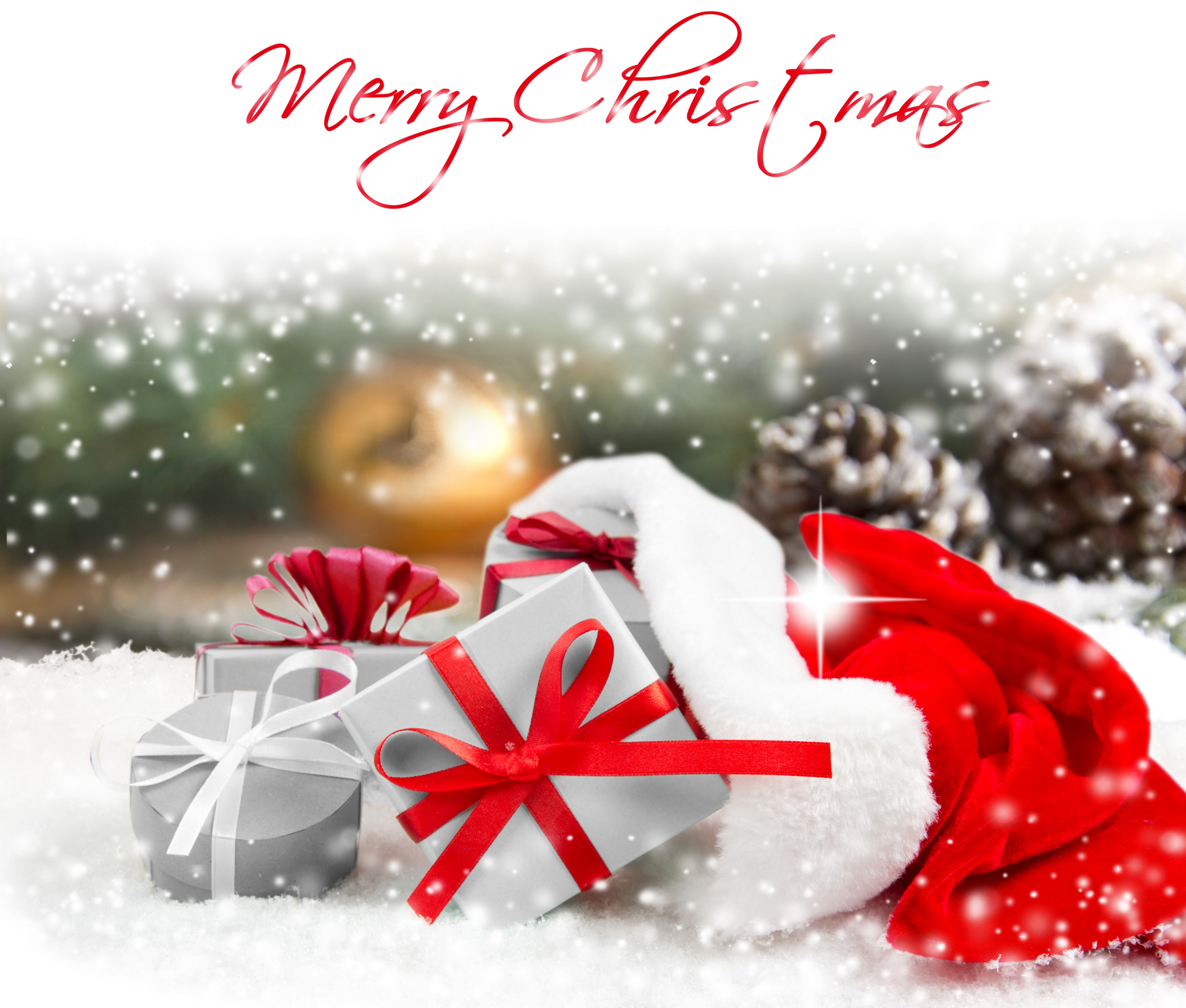 Christmas Gifts with Santa Hat and Snow HD Wallpaper