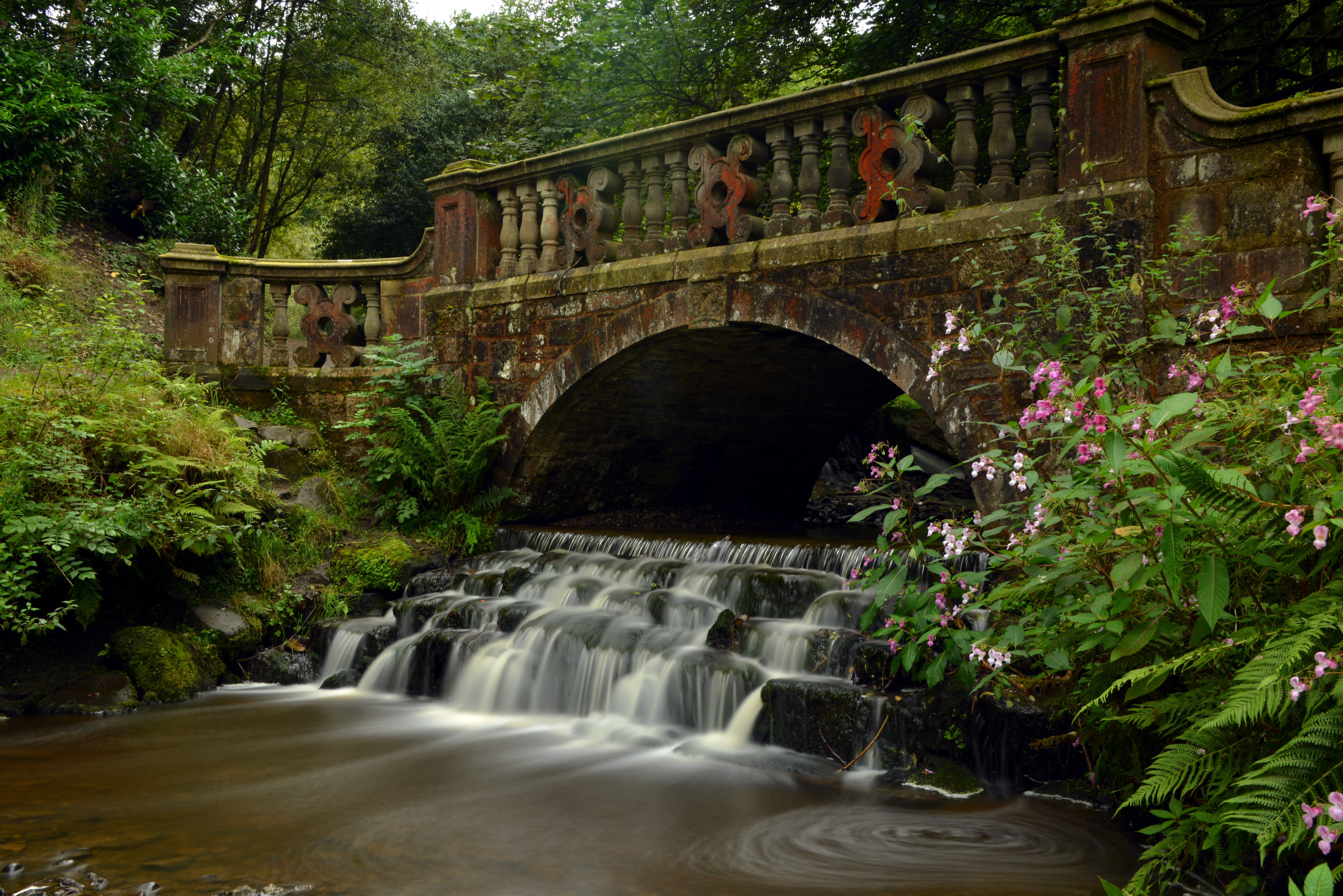 Stone bridge over a waterfall in Darwen, England HD Wallpaper