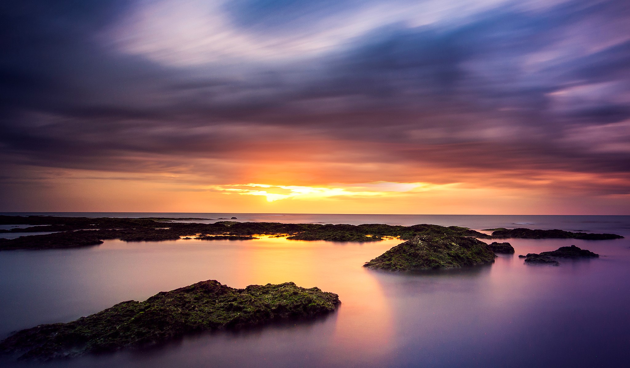 Sunset over the sea with rocks HD Wallpaper