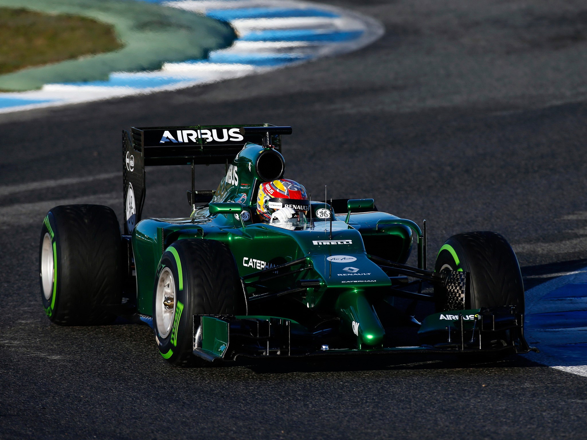 Green Caterham CT05 Formula 1 car on track HD Wallpaper