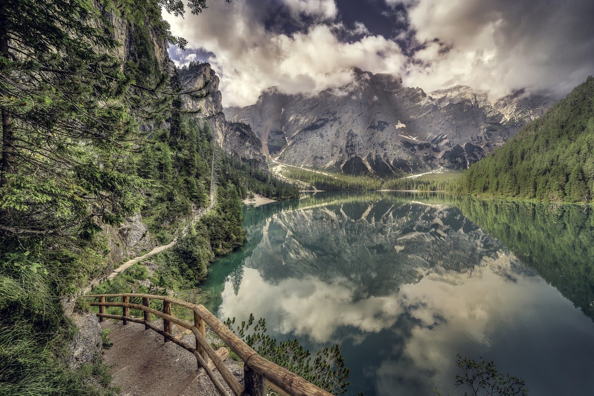 Mountain lake with reflection and wooden fence HD Wallpaper