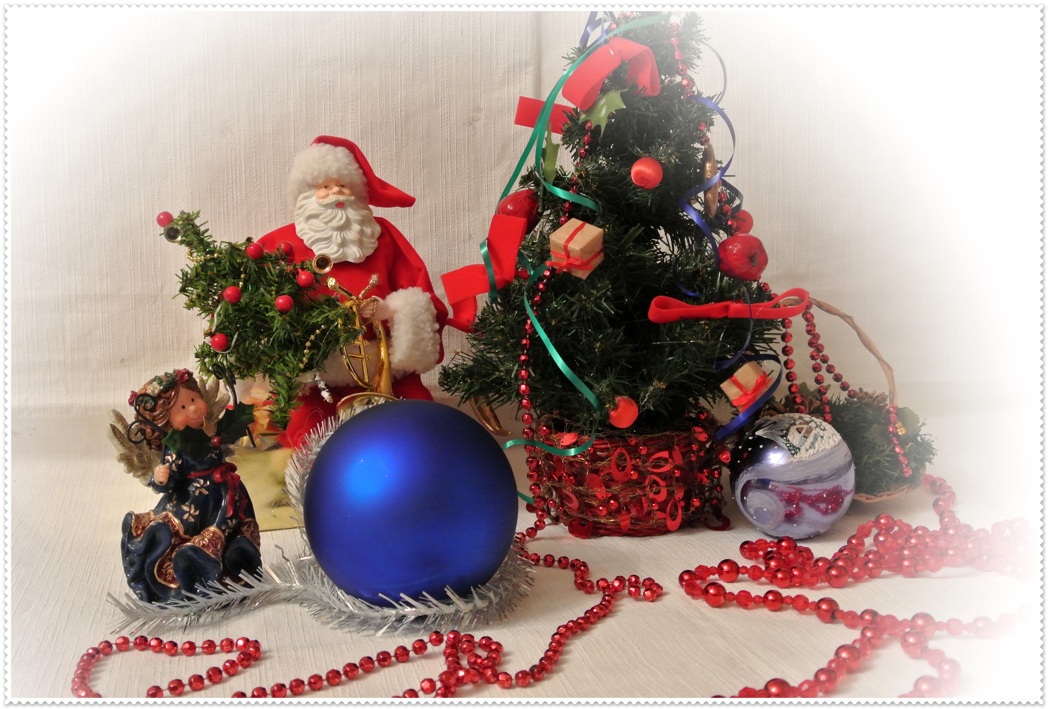 Christmas decorations with Santa Claus and angel figurine HD Wallpaper