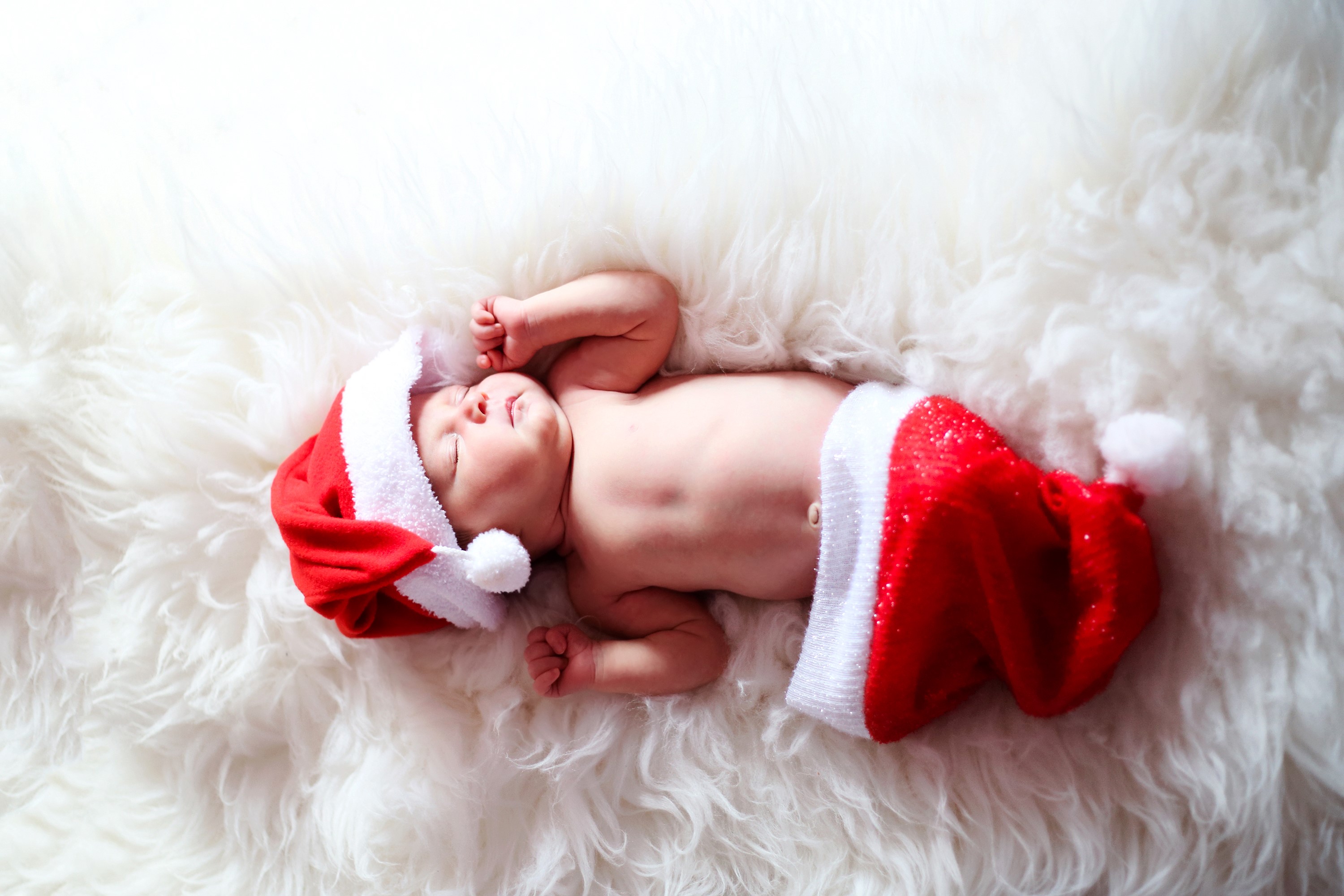 Baby in Santa Hat Sleeping on Fur HD Wallpaper