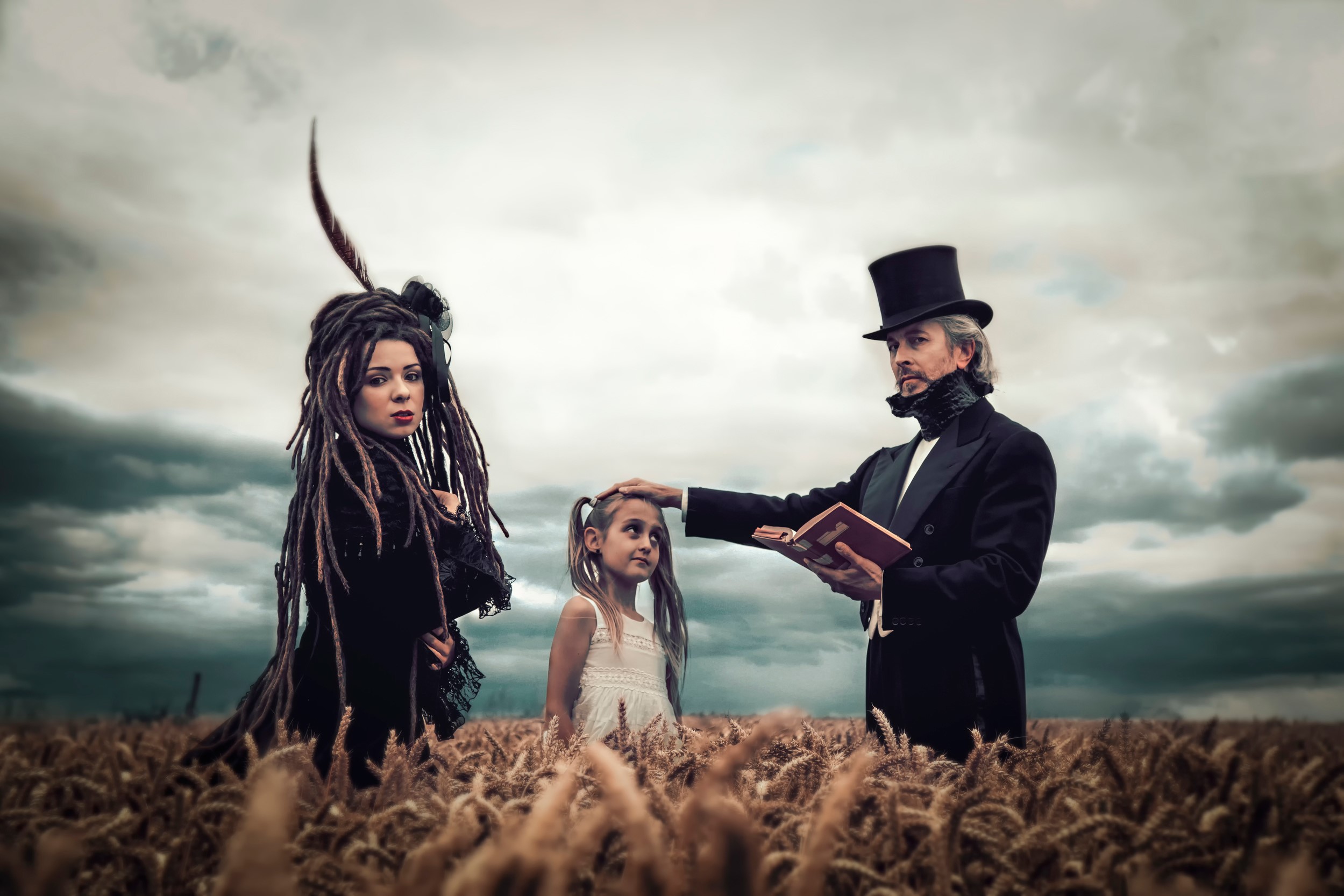 Man in Top Hat Reads to Girl in Field HD Wallpaper