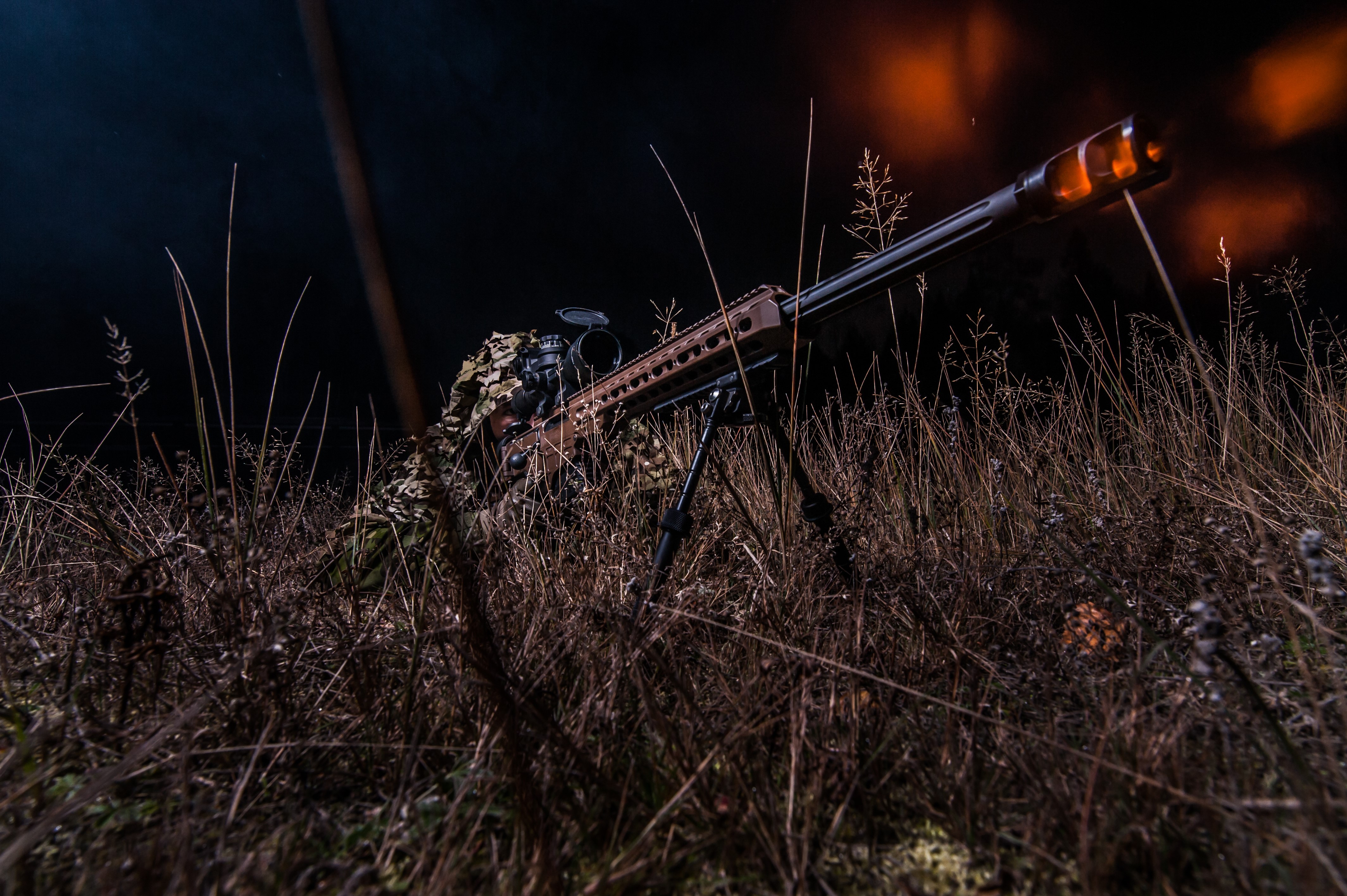 Sniper rifle in grass at night HD Wallpaper