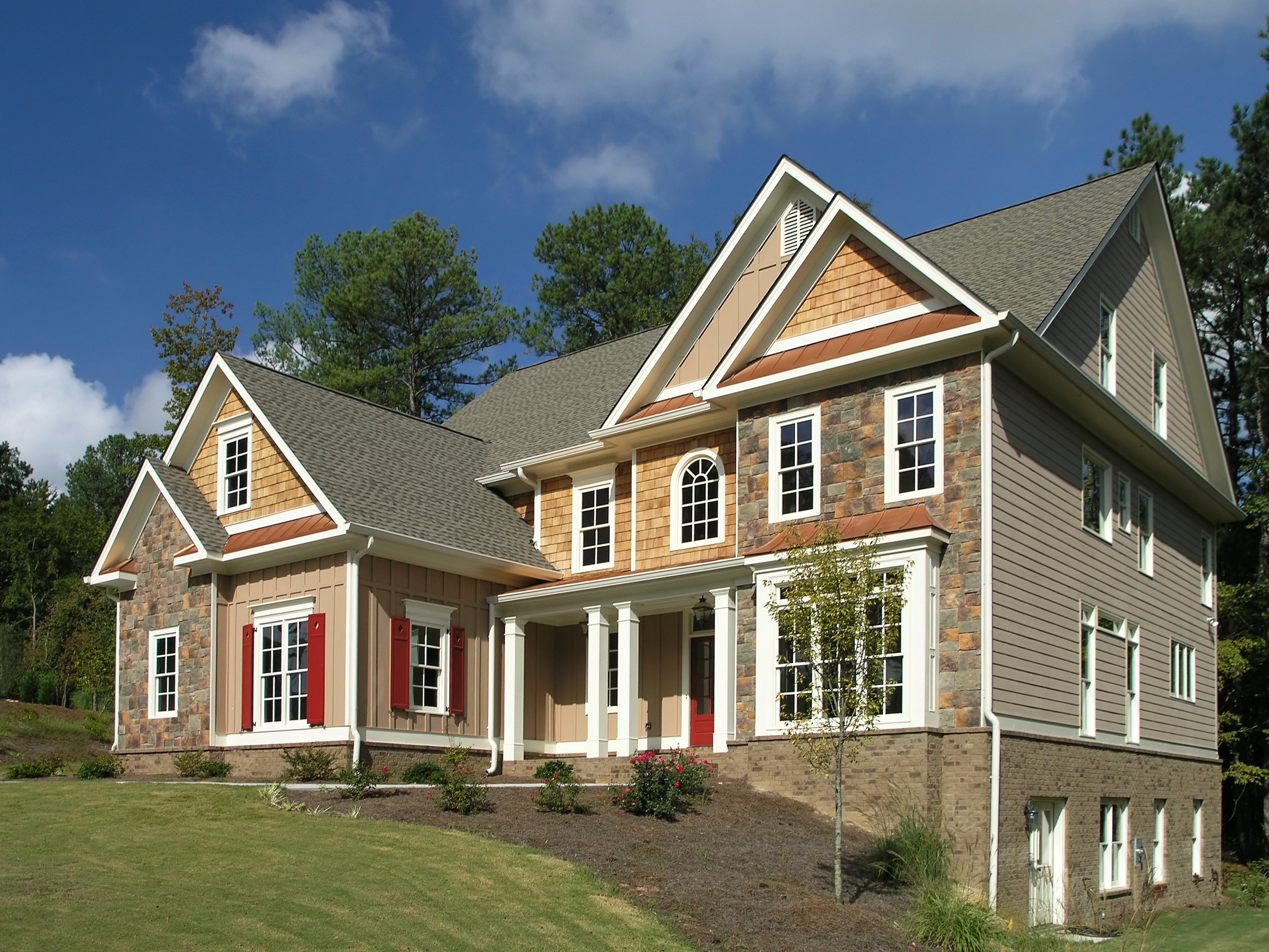 Large modern house with stone and wood exterior HD Wallpaper