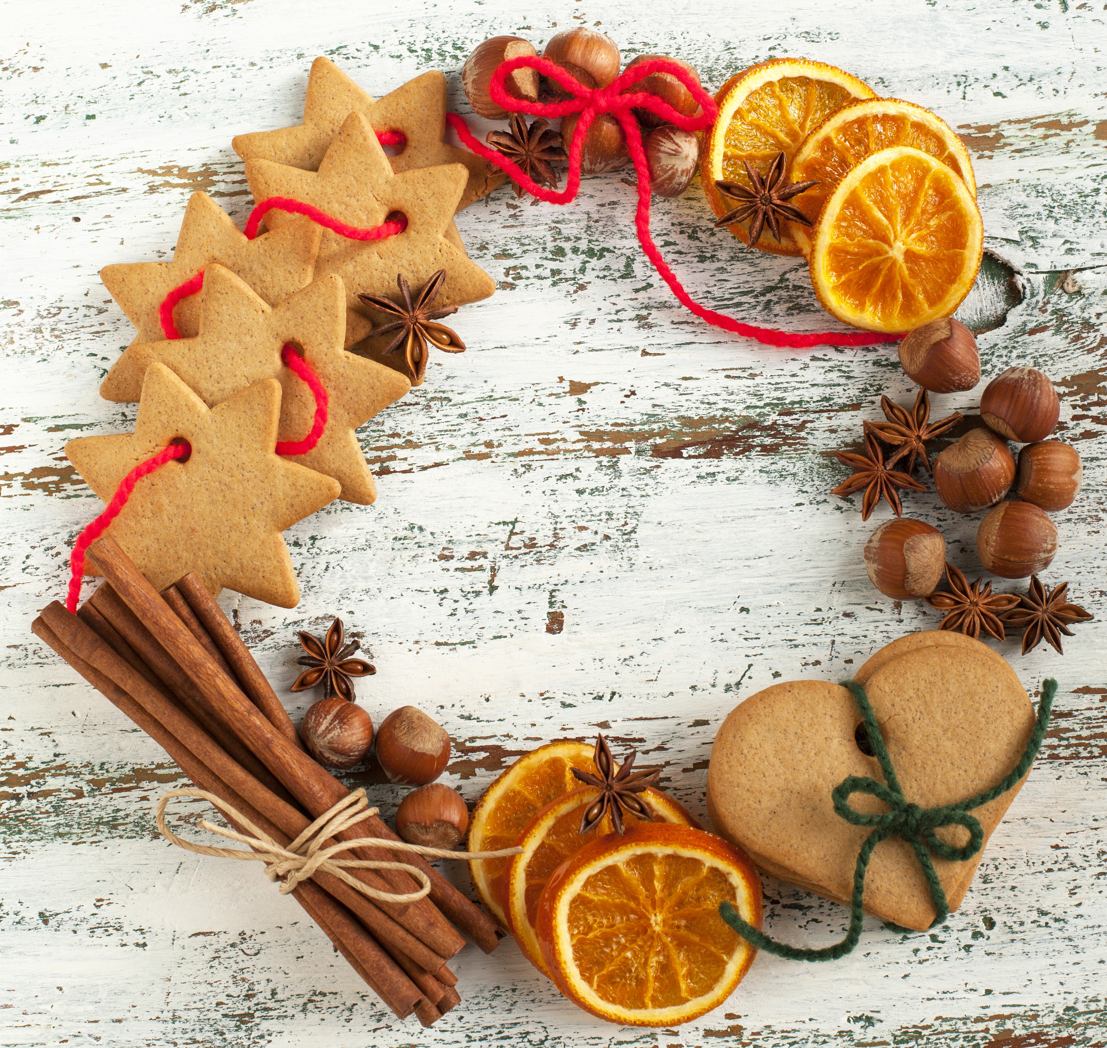 Christmas wreath with star cookies, oranges, nuts, and cinnamon HD Wallpaper