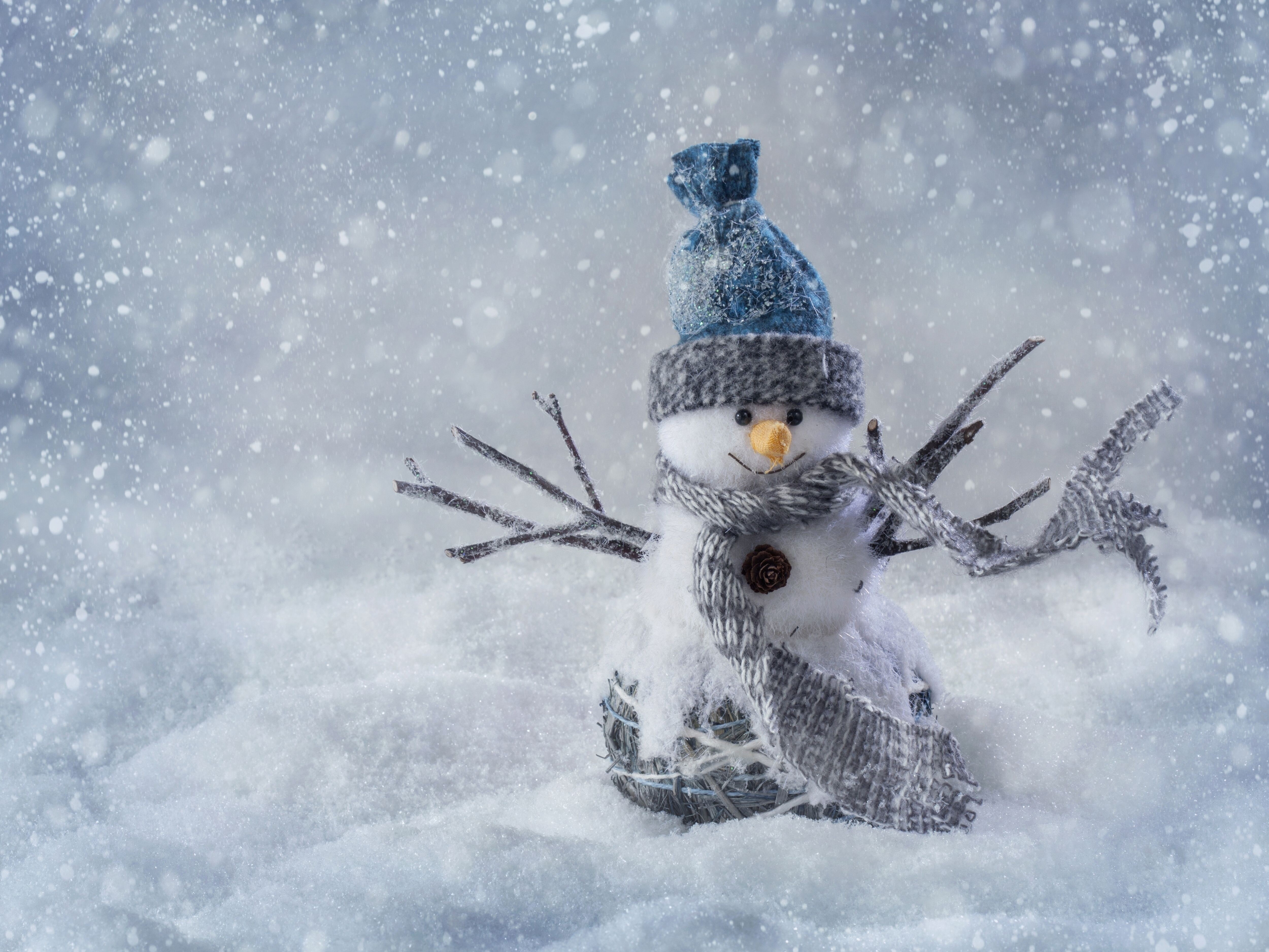 Snowman with hat and scarf in snow HD Wallpaper