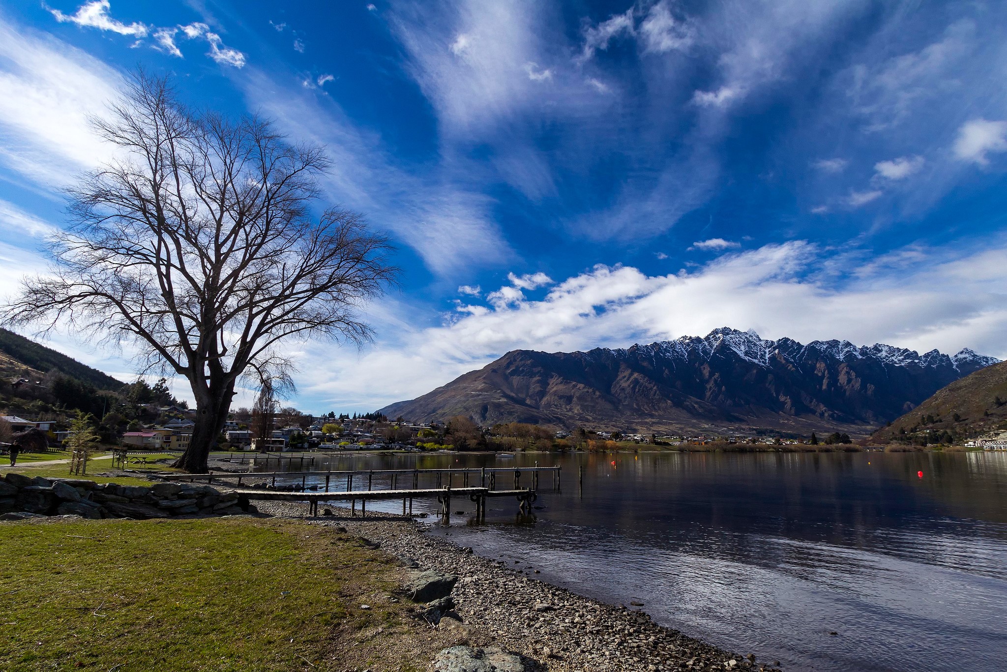 Lake and snow-capped mountains under a blue sky HD Wallpaper