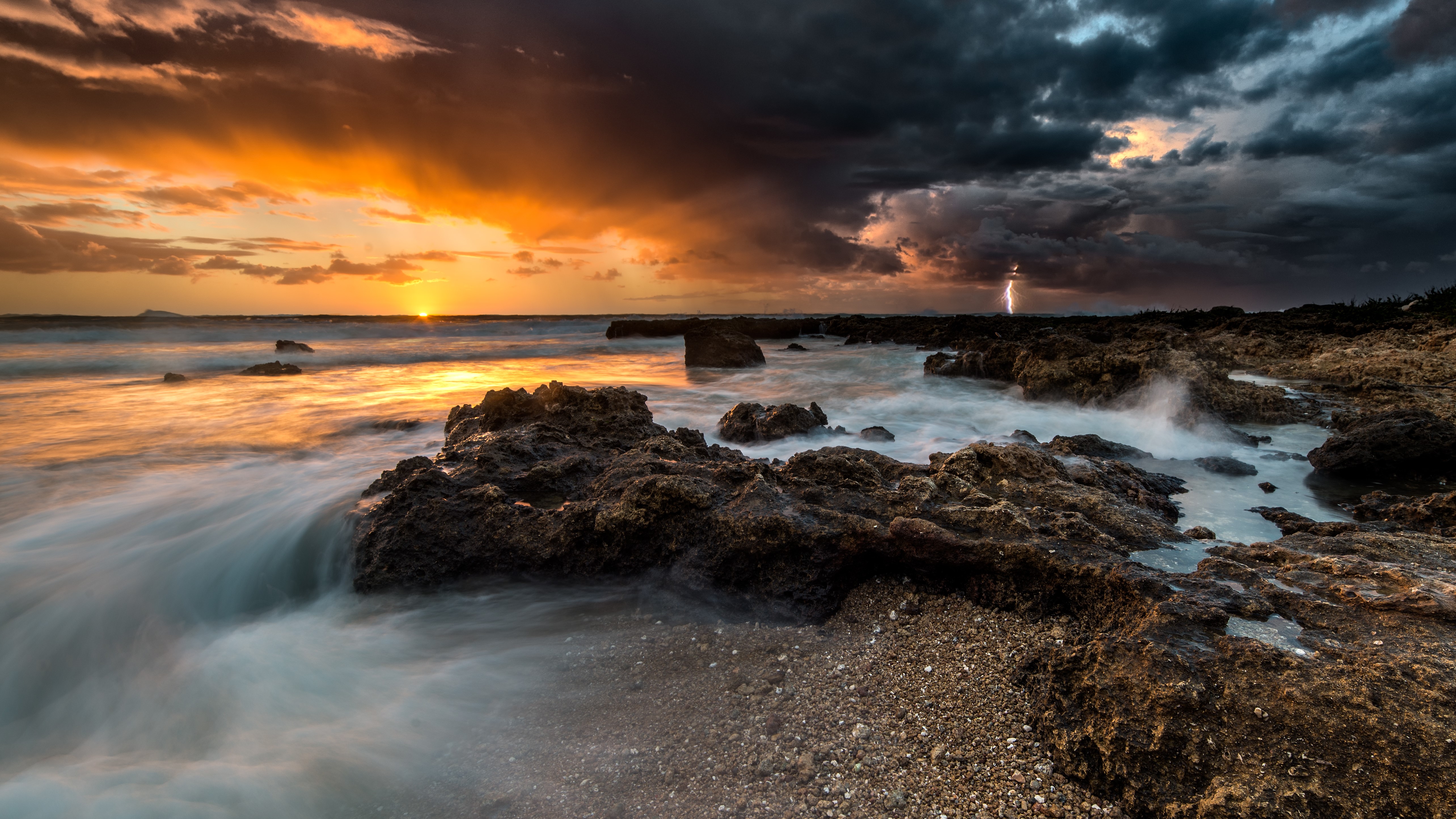 Sunset over the sea with lightning and storm clouds HD Wallpaper