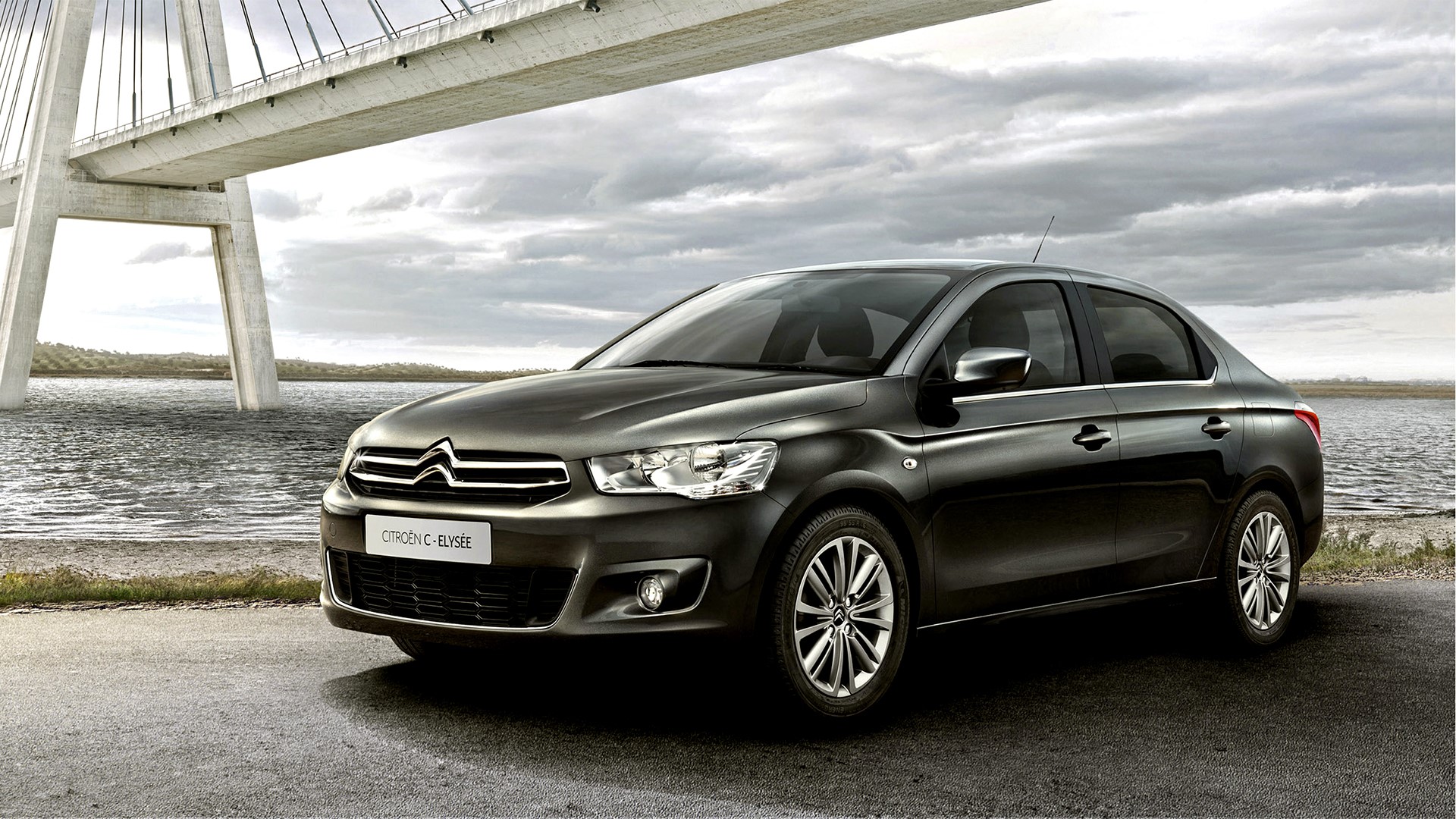 Citroen C-Elysee sedan by a bridge HD Wallpaper