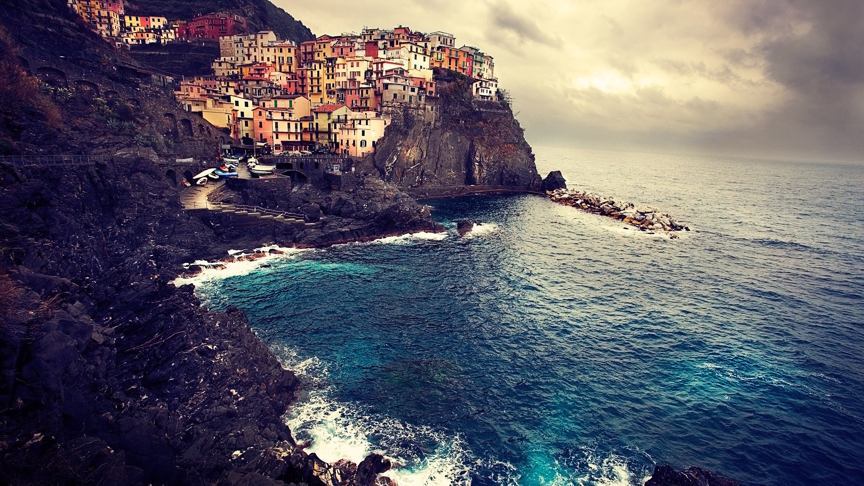 Colorful village on a cliff overlooking the sea HD Wallpaper