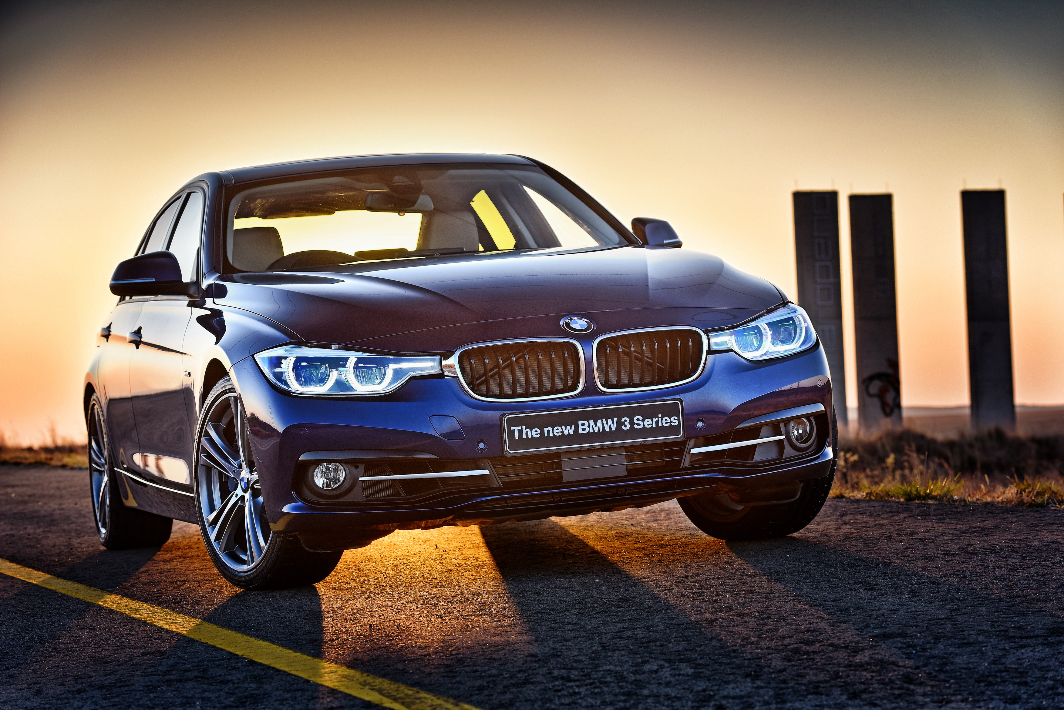 The new BMW 3 Series sedan at sunset HD Wallpaper