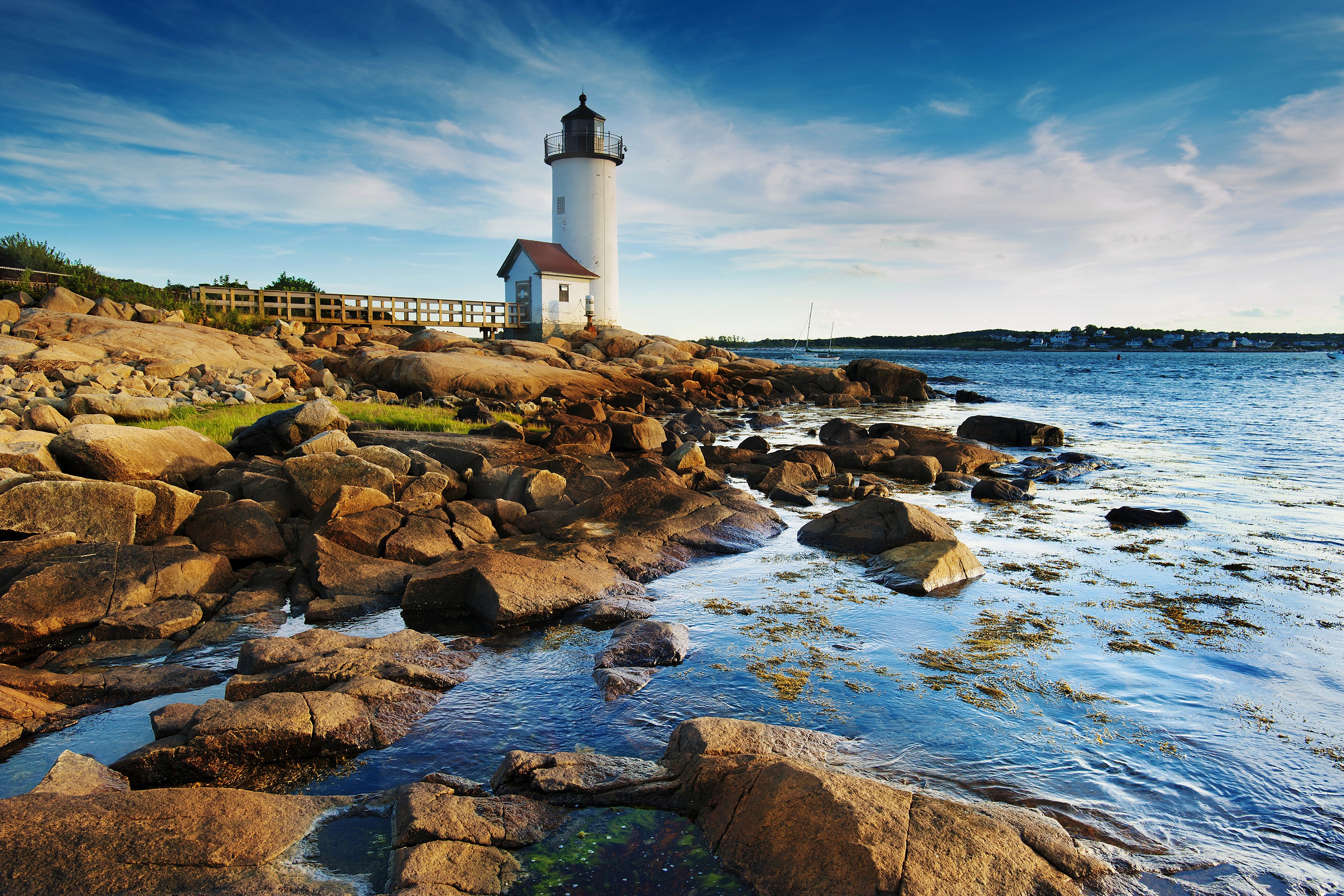 Rocky Coastline with Lighthouse and Blue Sky HD Wallpaper