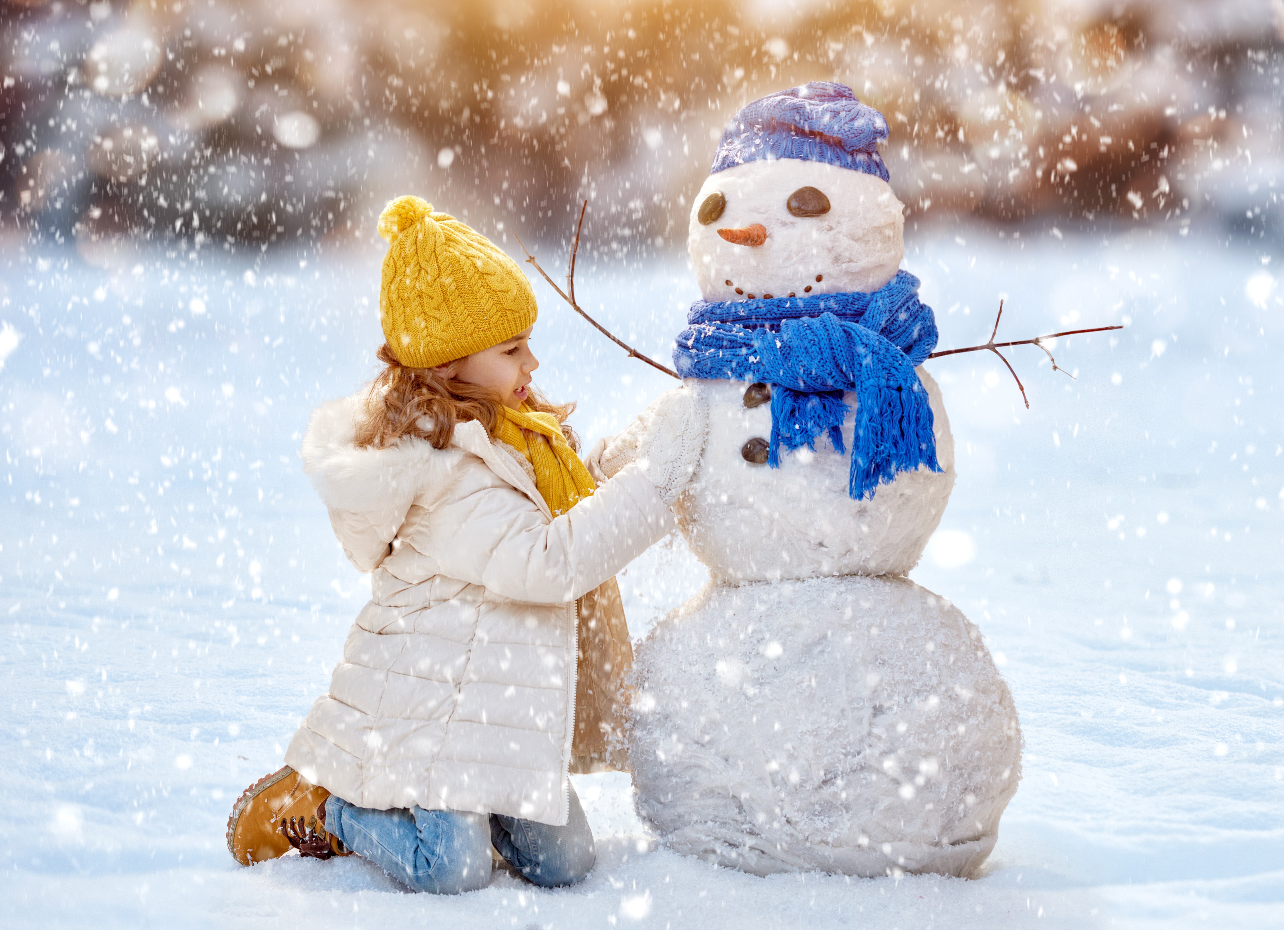 Girl Building a Snowman in Winter HD Wallpaper