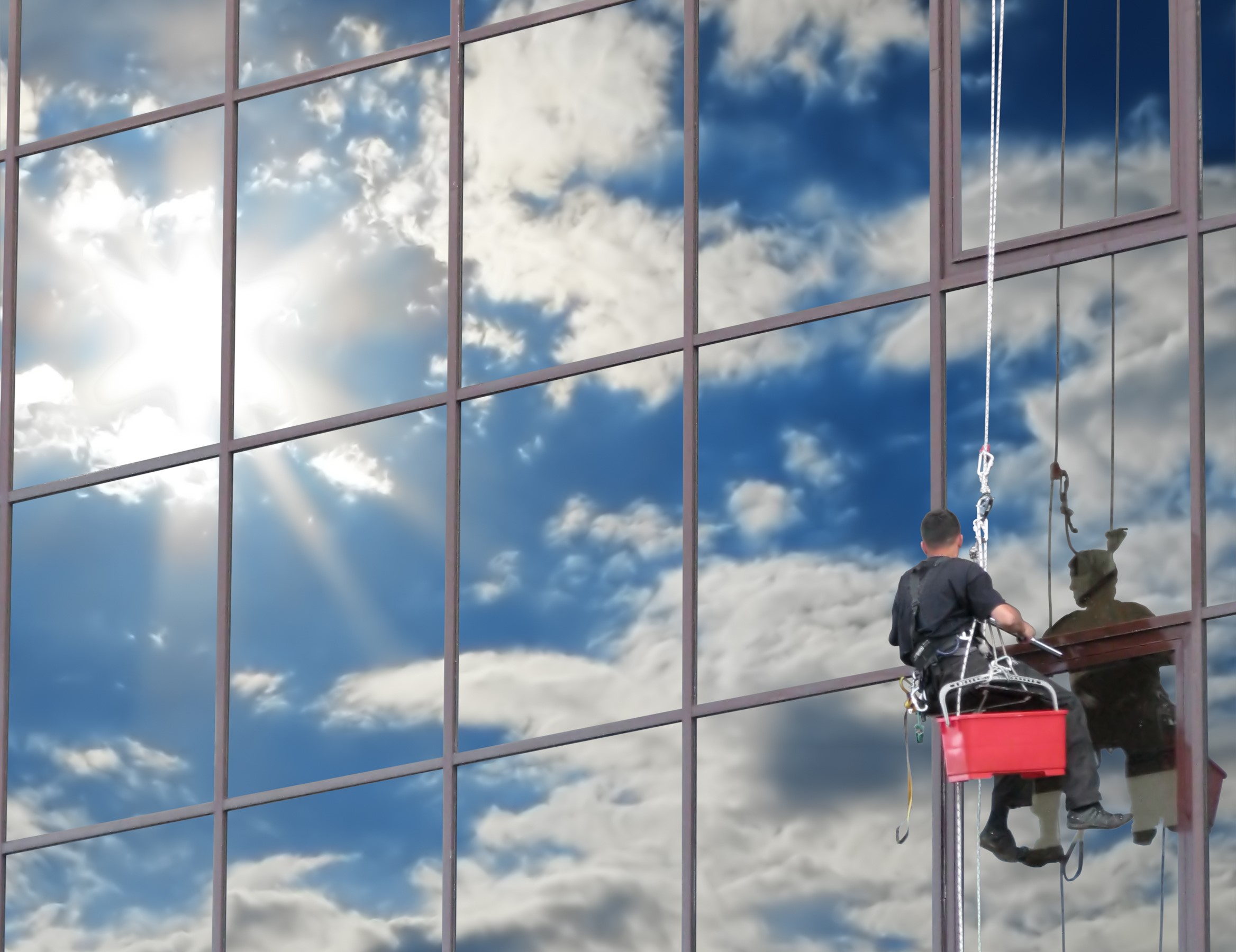 Window cleaner on a high-rise building HD Wallpaper