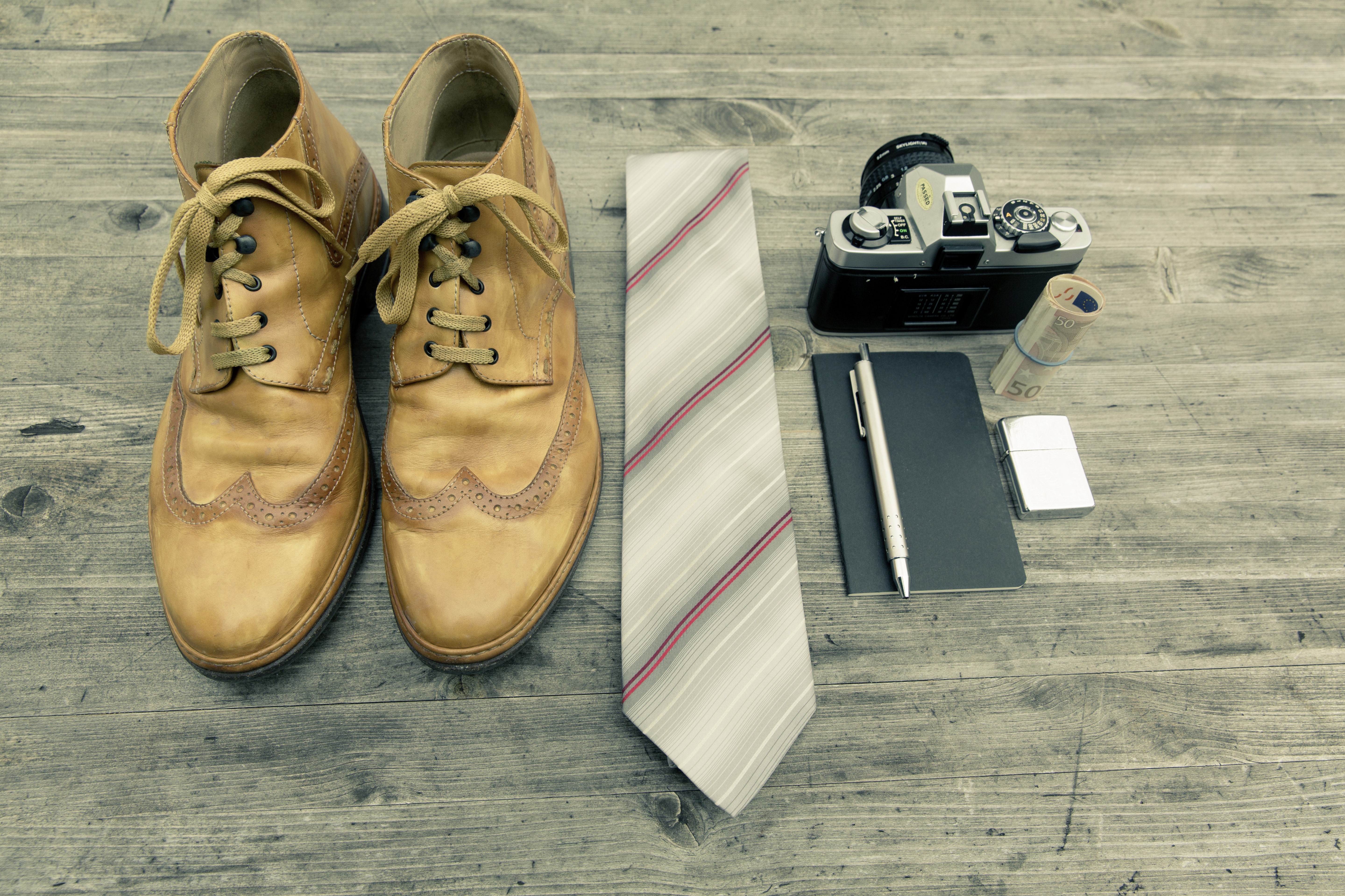 Boots, Necktie, Camera, and Money on Wooden Surface HD Wallpaper