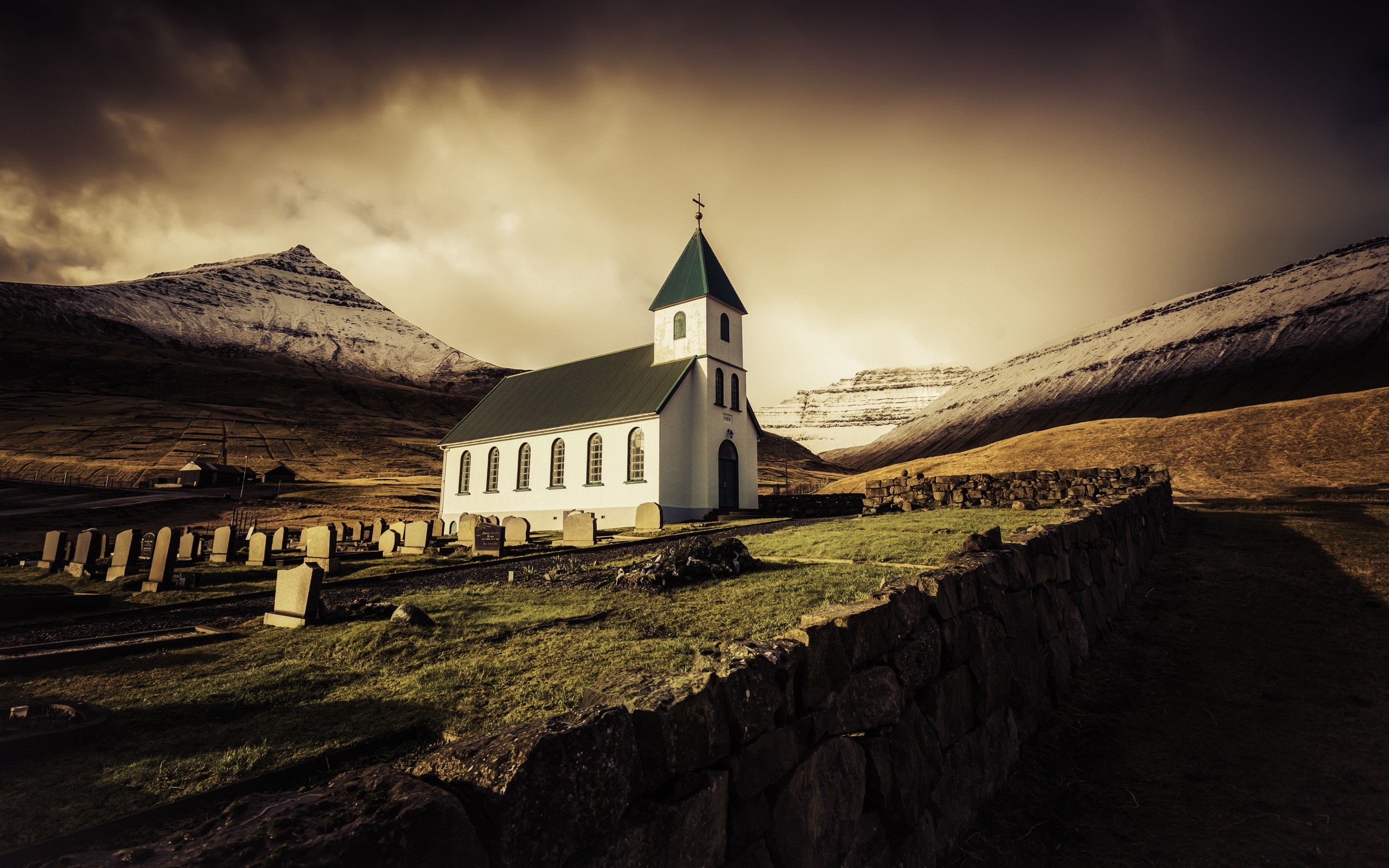 Church and graveyard in Faroe Islands mountains HD Wallpaper