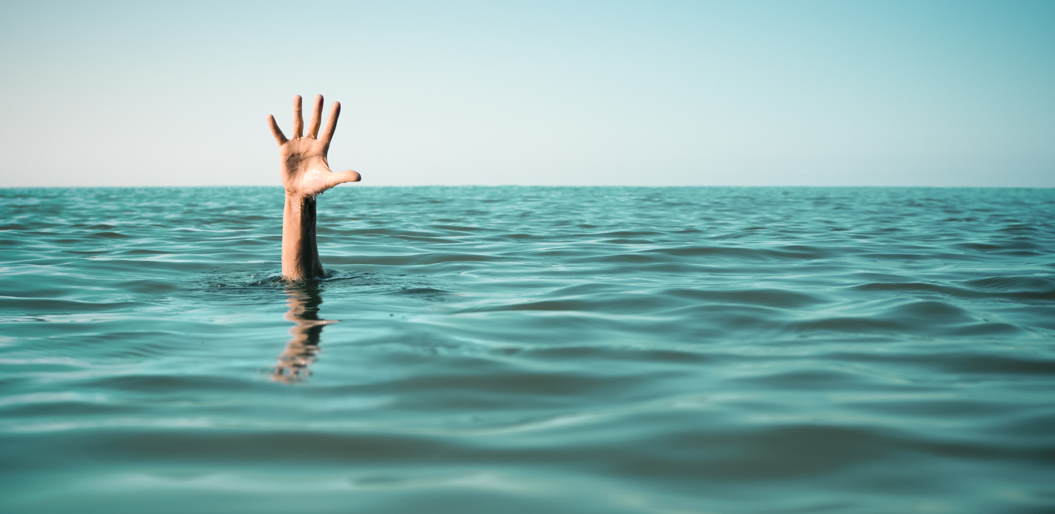 Hand reaching out of the sea HD Wallpaper