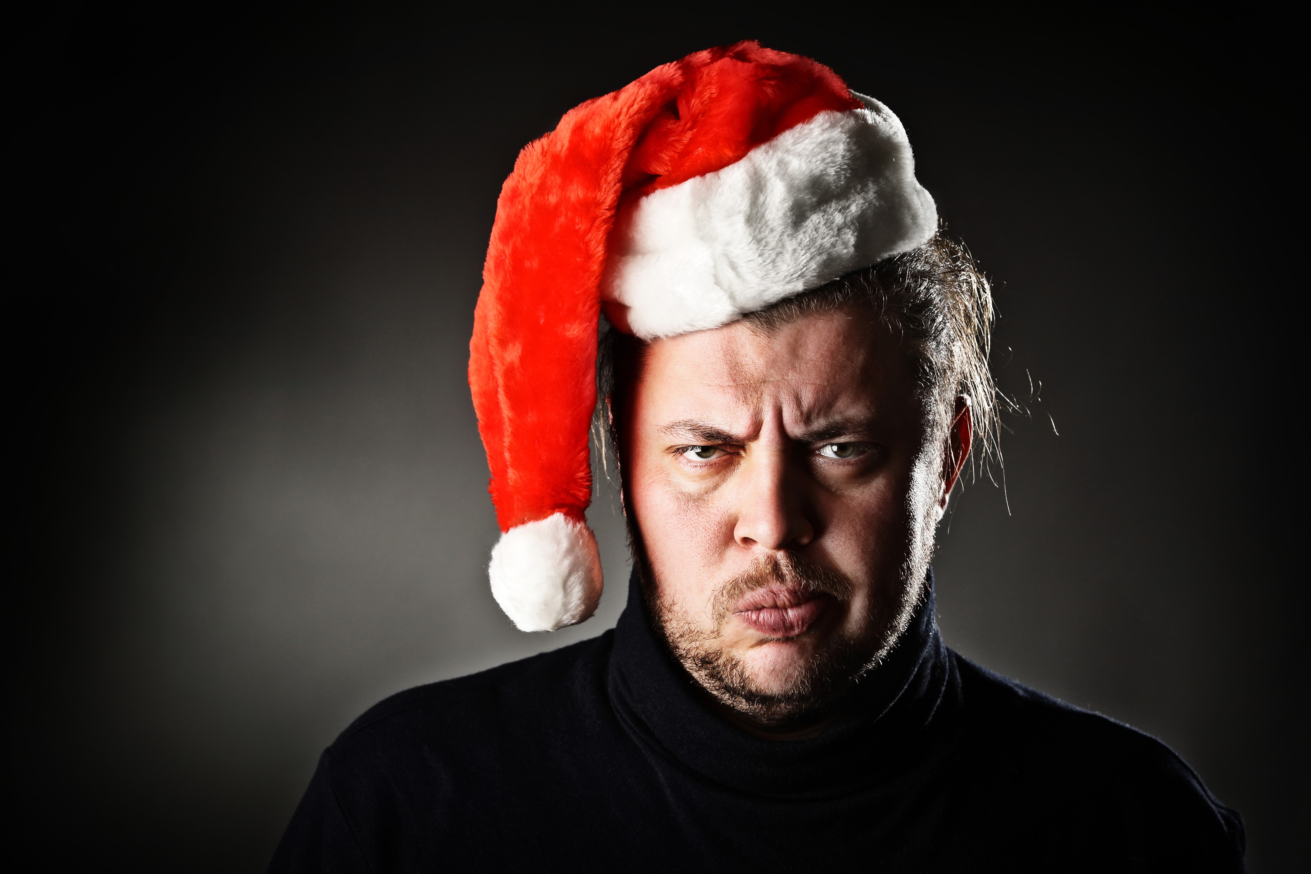Man wearing a Santa hat HD Wallpaper