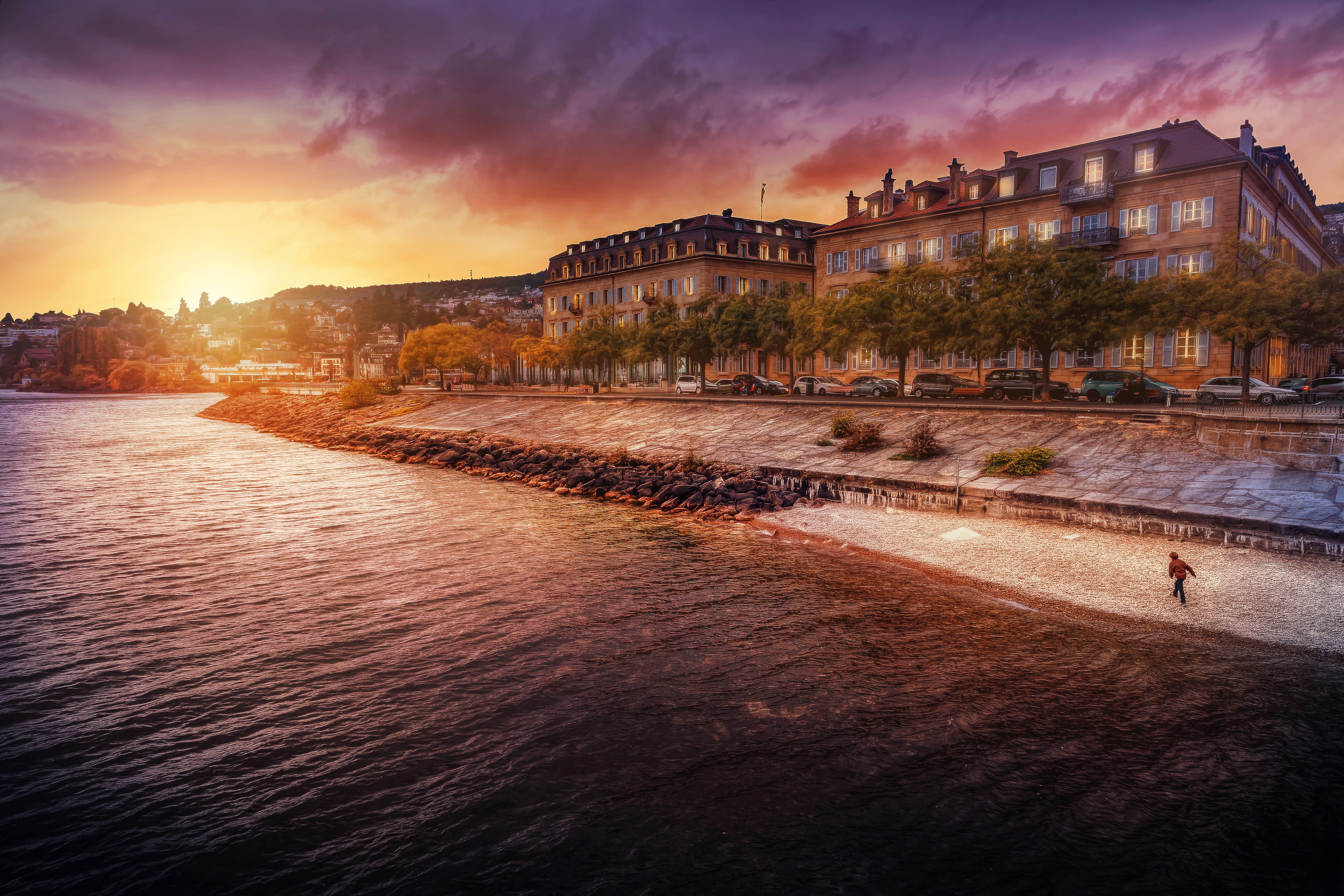 Buildings by the water at sunset HD Wallpaper