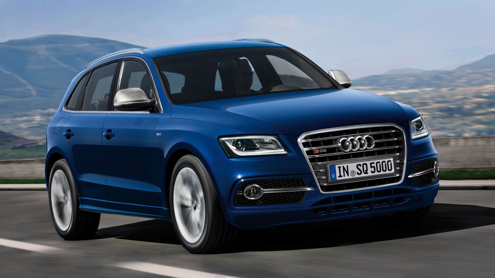 Blue Audi SQ5 Driving on a Mountain Road HD Wallpaper