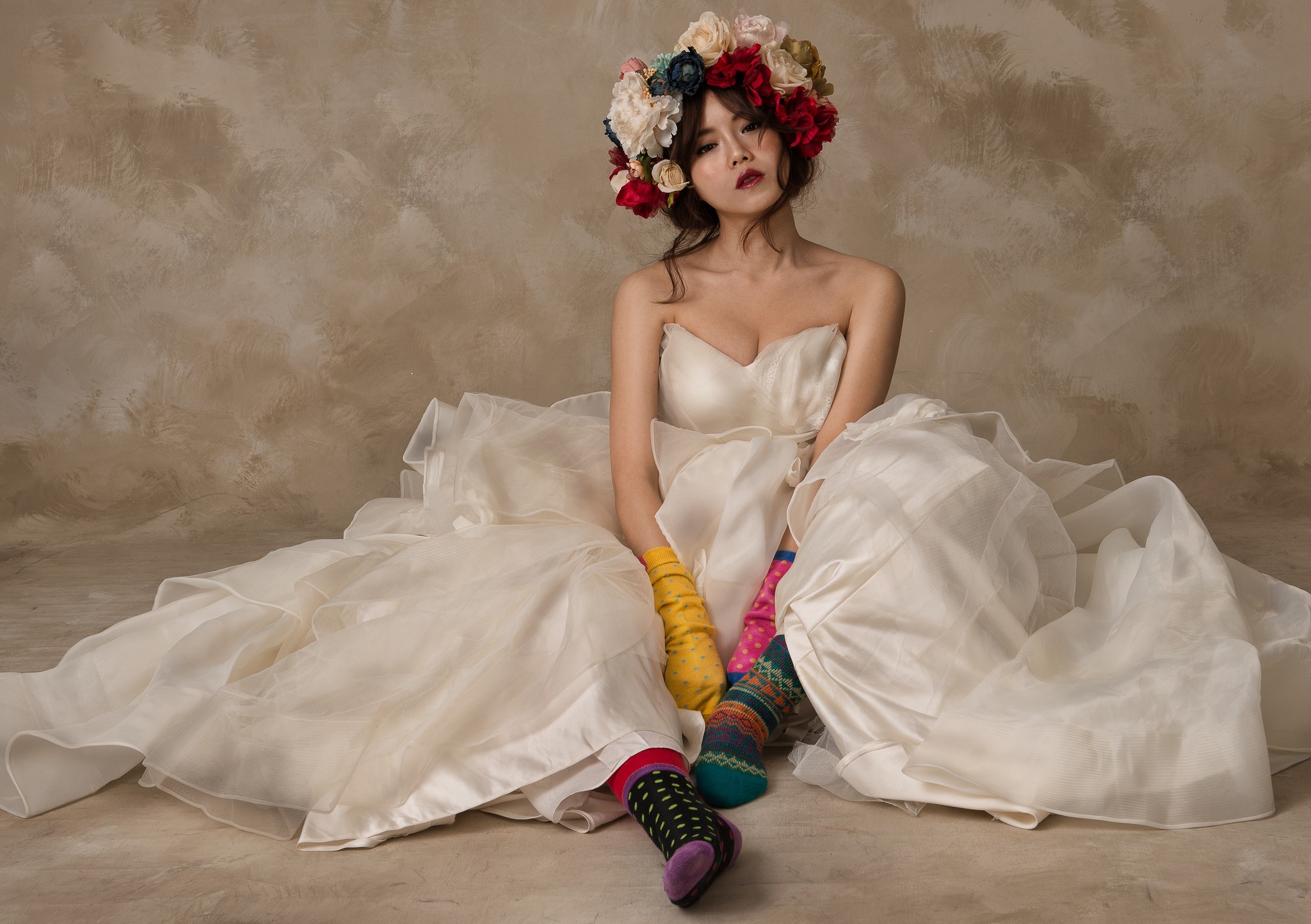 Asian woman in wedding dress with flower crown and colorful socks HD Wallpaper