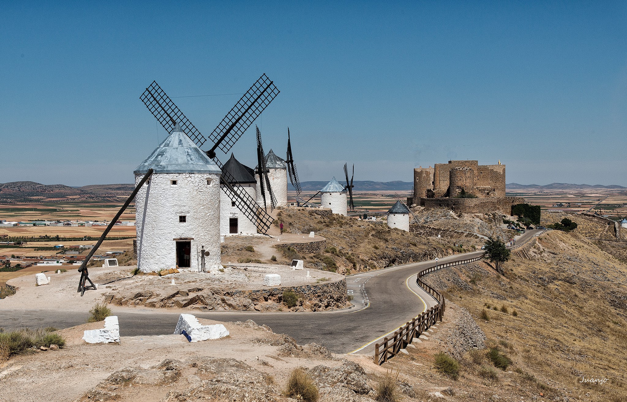 Windmills and castle on a hill HD Wallpaper