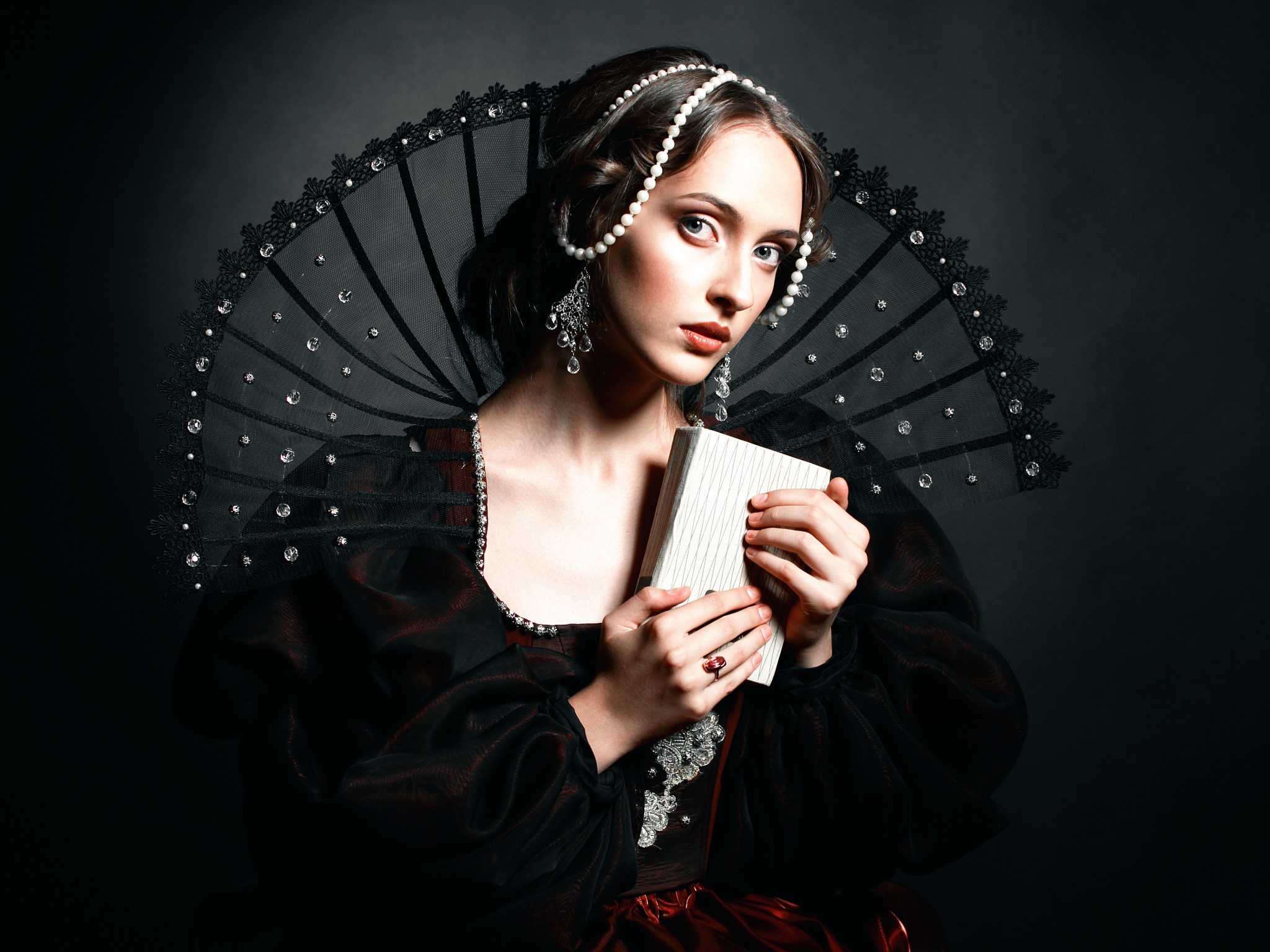 Woman in Renaissance attire holding a book HD Wallpaper