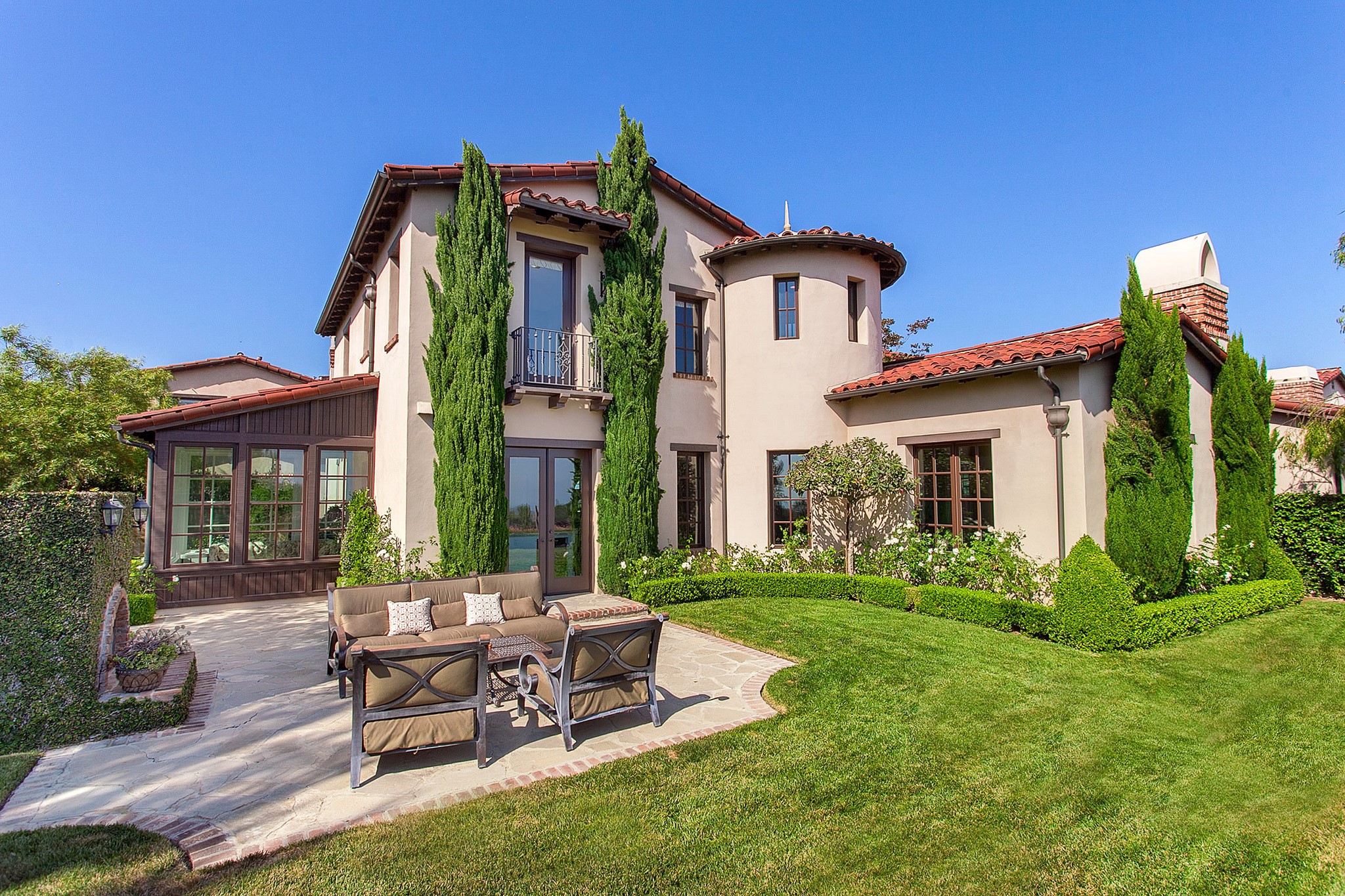Mediterranean style house with outdoor seating area HD Wallpaper